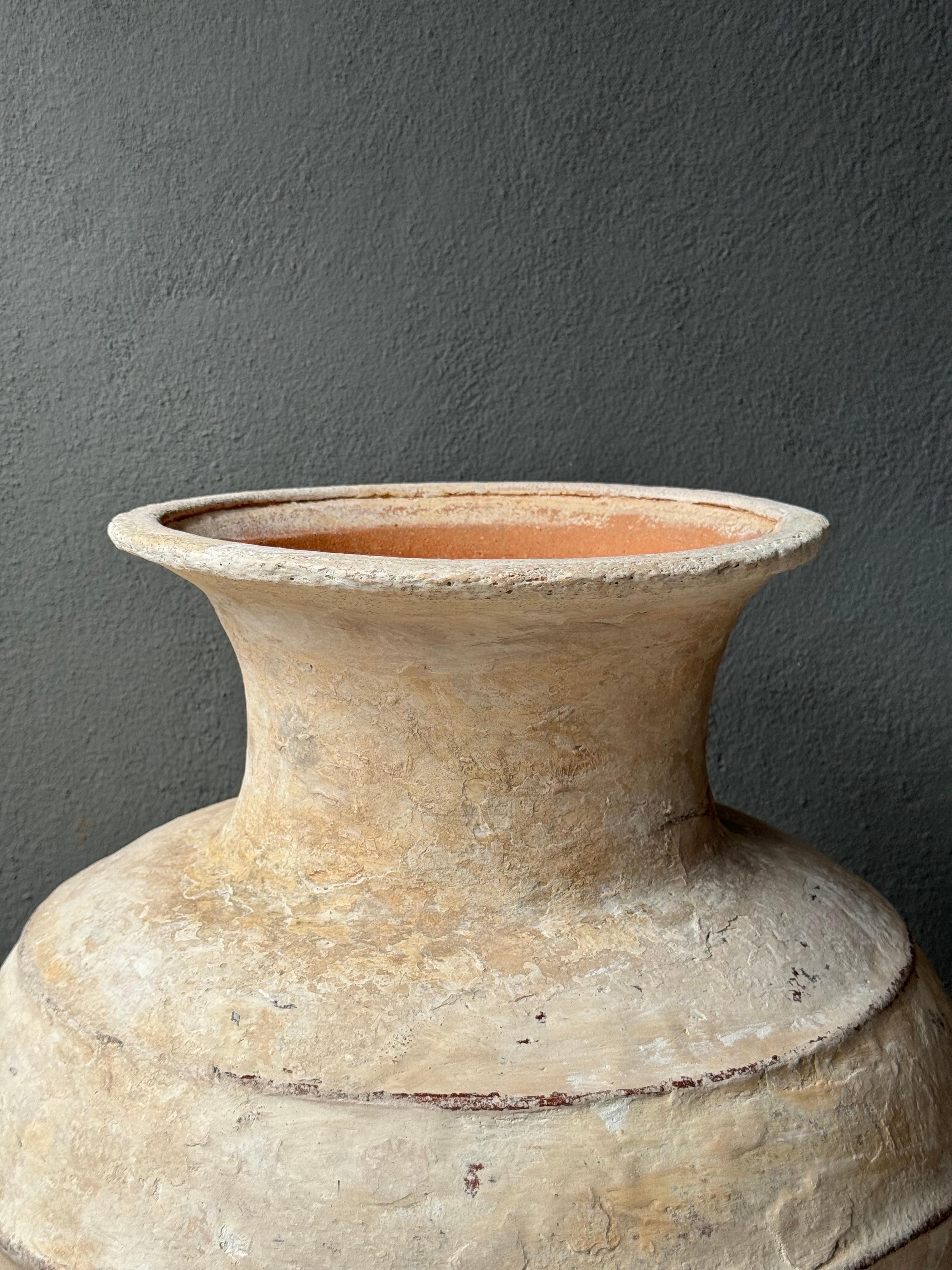 Ceramic water vessel from Central Yucatan, Mexico, early 20th century. The Mayan communities generally used white plaster on their terracotta jars in order to maintain the water at a cooler temperature. This technique not only helped insulate the