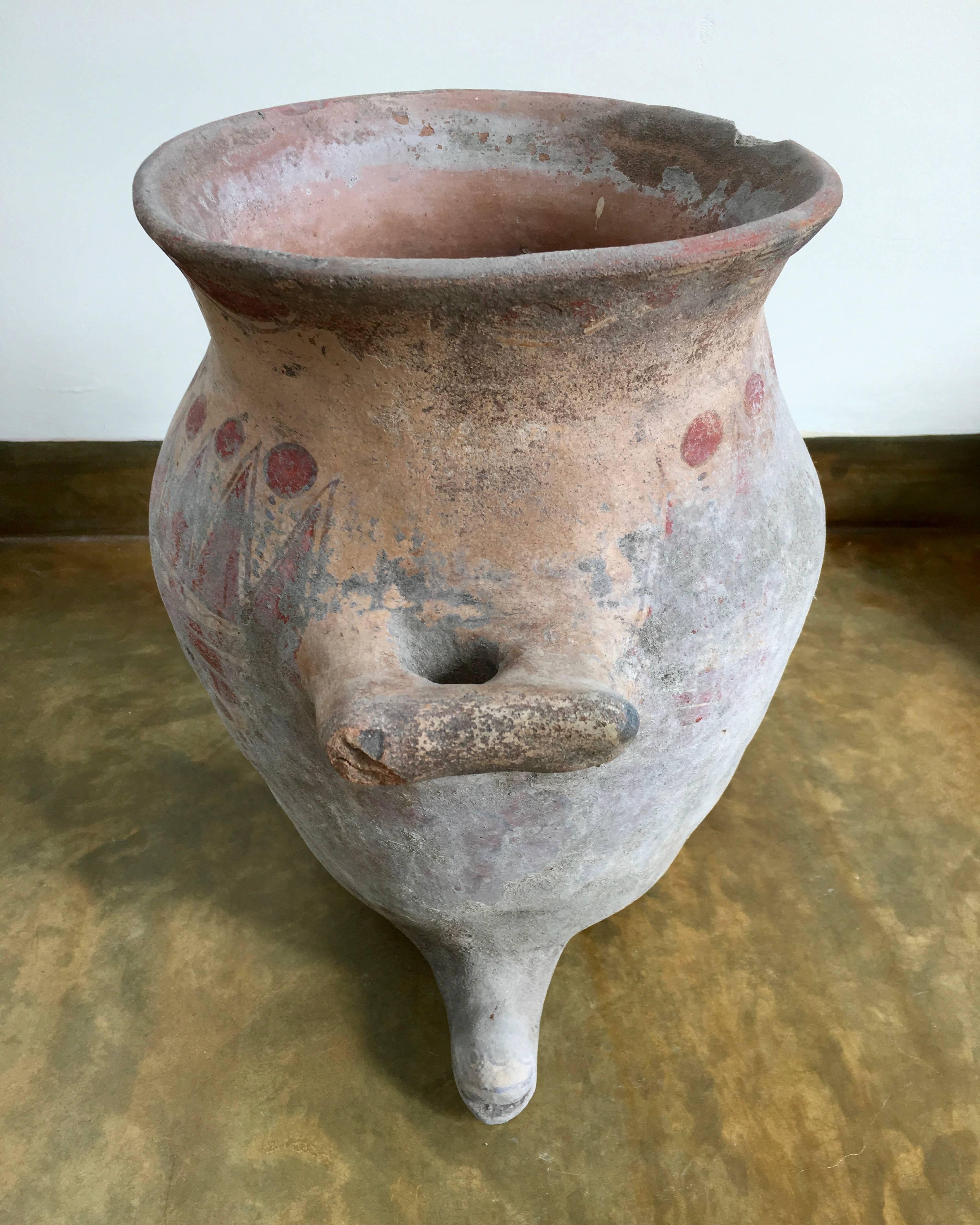 Rare and unusual 1920's hand-formed clay pot from San Agustin Oapan, Guerrero, Mexico. 3 snake base.