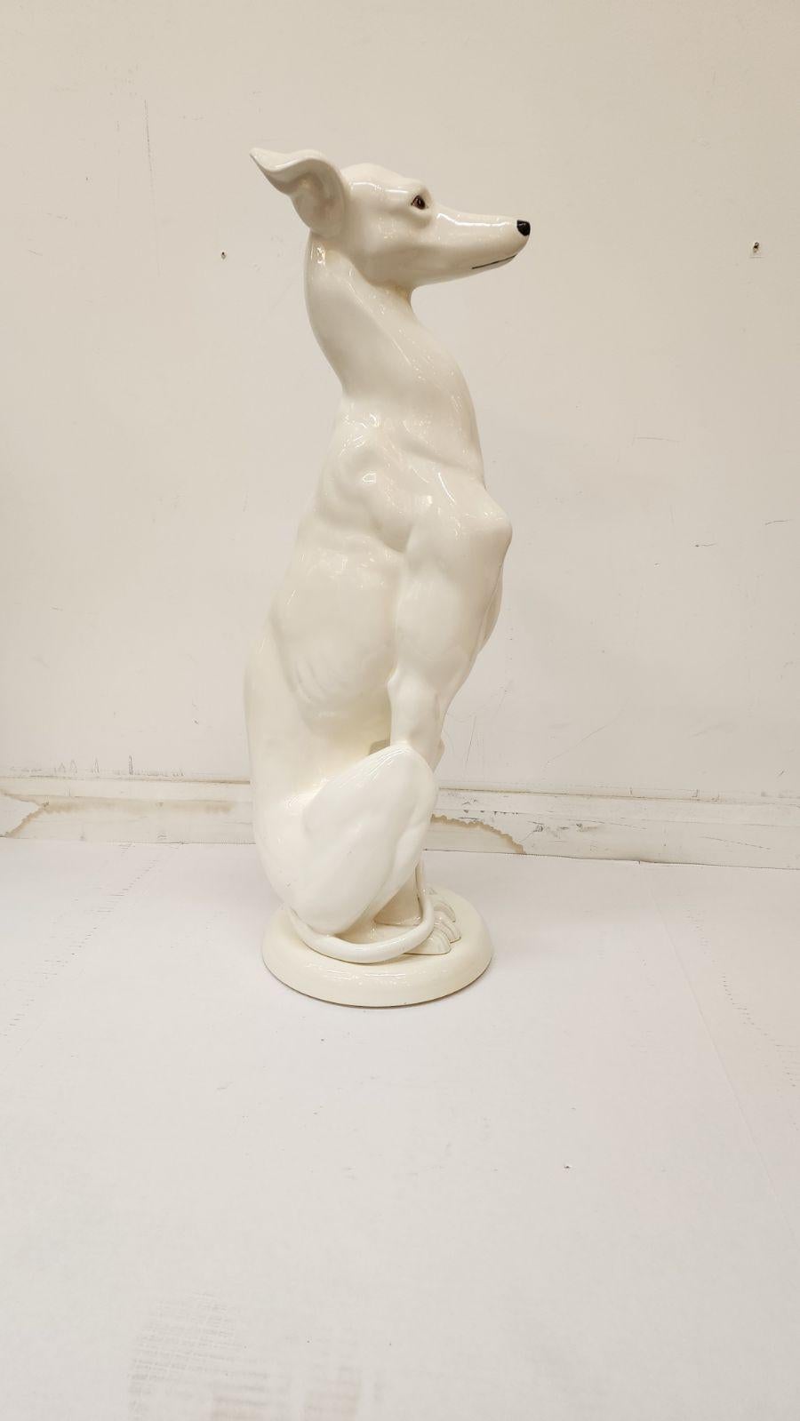 Ceramic white whippet on unattached base.