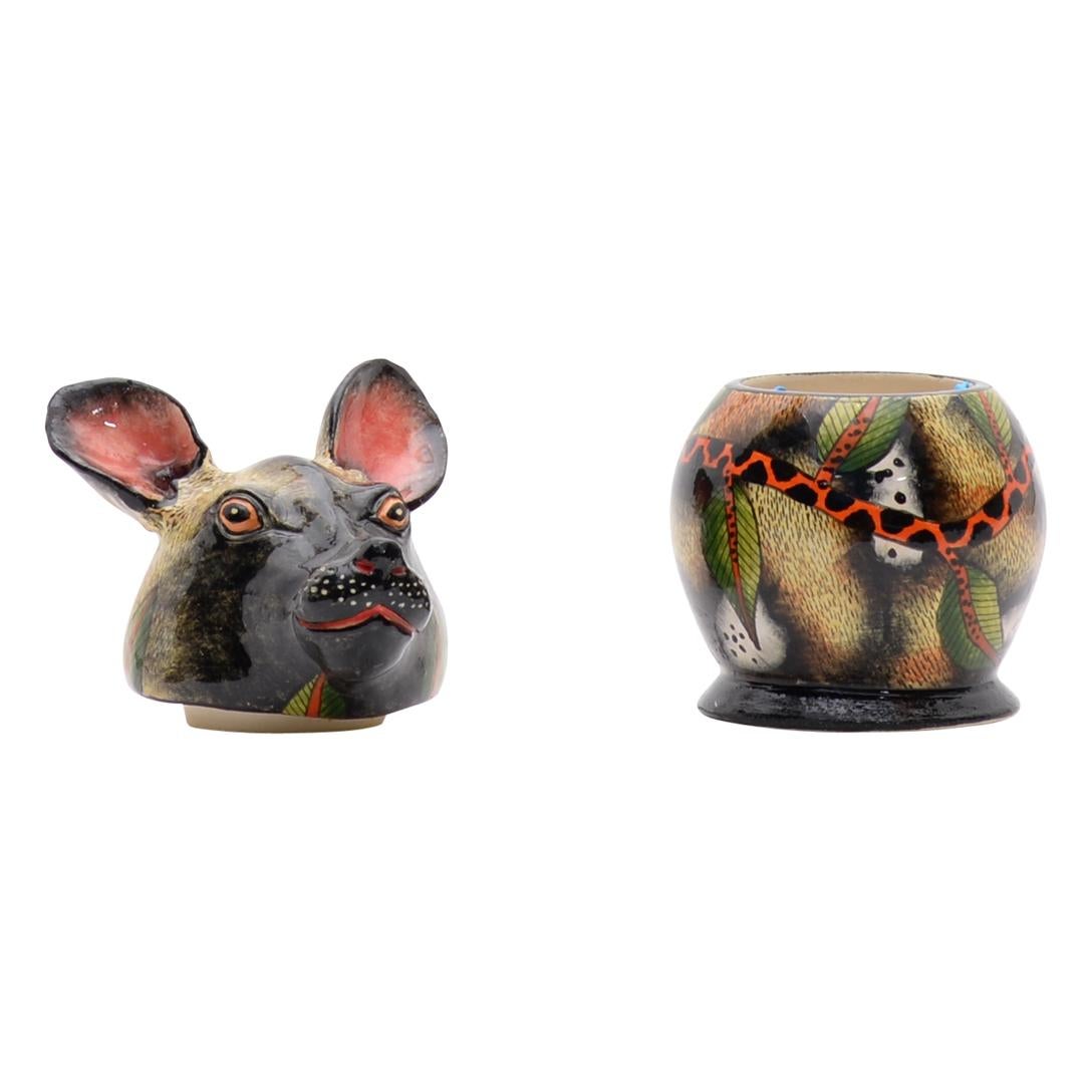 Wild Dog Jewelry Box Hand-Painted by Minehle Nene and Sculpted by Motsamai Sello

The Wild Dog Jewelry Box from Love Art Ceramic is a stunning piece of decorative art that beautifully encapsulates the essence of one of Africa's most social and
