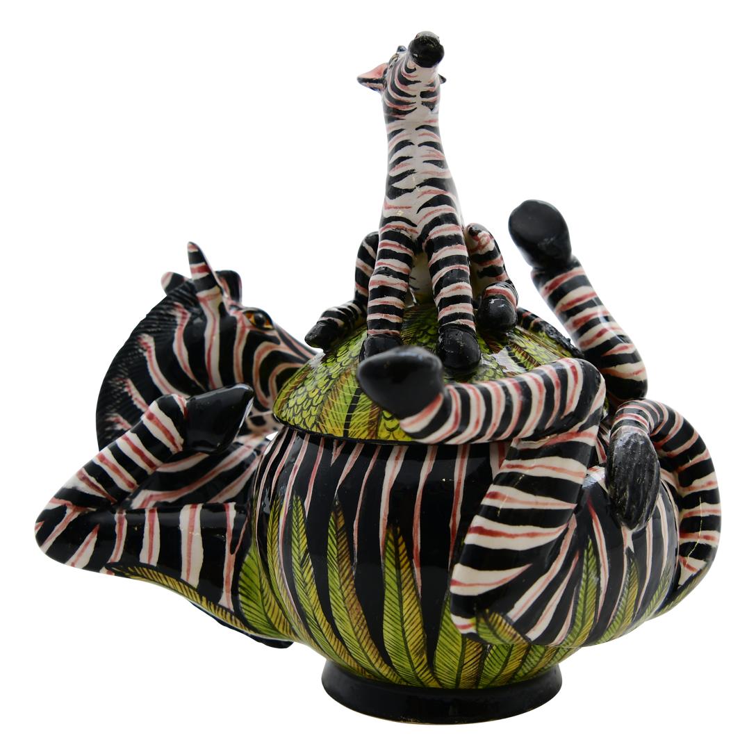 Crafted with care by Sbusiso and Zimhle at Love Art Ceramic in South Africa, this Zebra jewelry box is a tribute to African artistry. The ceramic piece, measuring 4 inches high, 5 inches long, and 4 inches wide, captures the spirit of the zebra, an