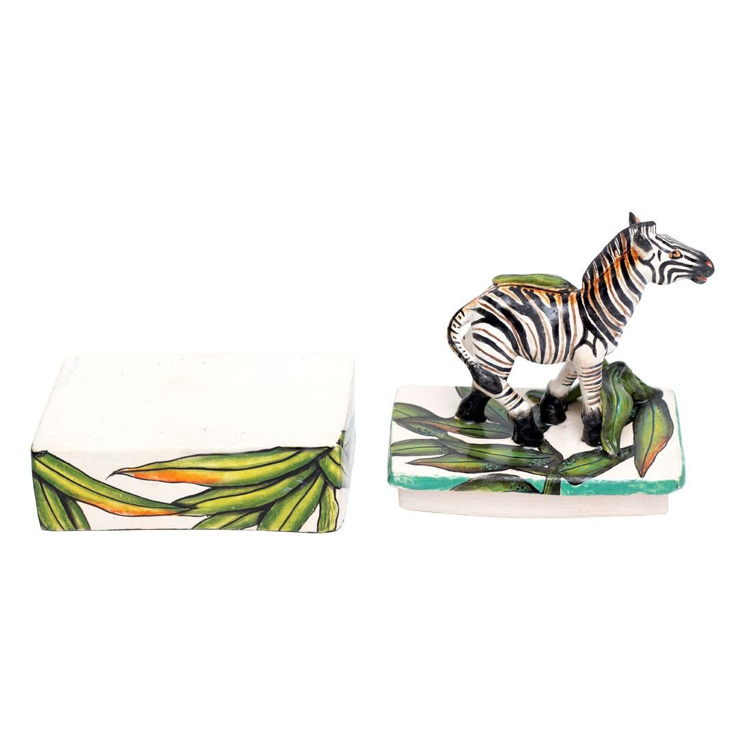 Introducing a stunning ceramic Zebra jewelry box, meticulously hand-painted by Samukelo Gumede and hand-sculpted by Bennet Zondo at the renowned Imvelo Natural Art pottery studio in South Africa. This exquisite piece stands 6 inches high, 5 inches