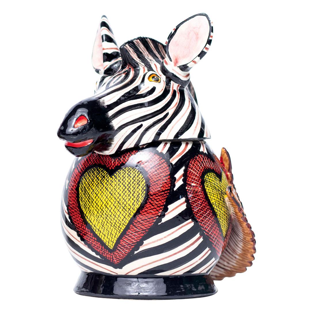 Zebra Jewelry Box
Hand Painted by Jabu Nene, Sculpted by Motsamai Sello
Love Art Ceramic, South Africa

The Zebra Jewelry Box is a stunning ceramic masterpiece that brings the vibrant spirit of South African wildlife into your home. Standing at 6