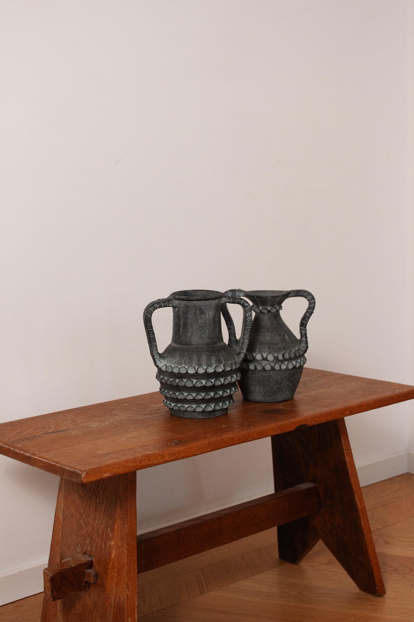 Shipping note: If your region or country is not listed under the shipping options please contact us directly.

This striking handmade black vase from Cerámica Partenon captures the essence of mid-century Spanish design with its sleek, minimalist