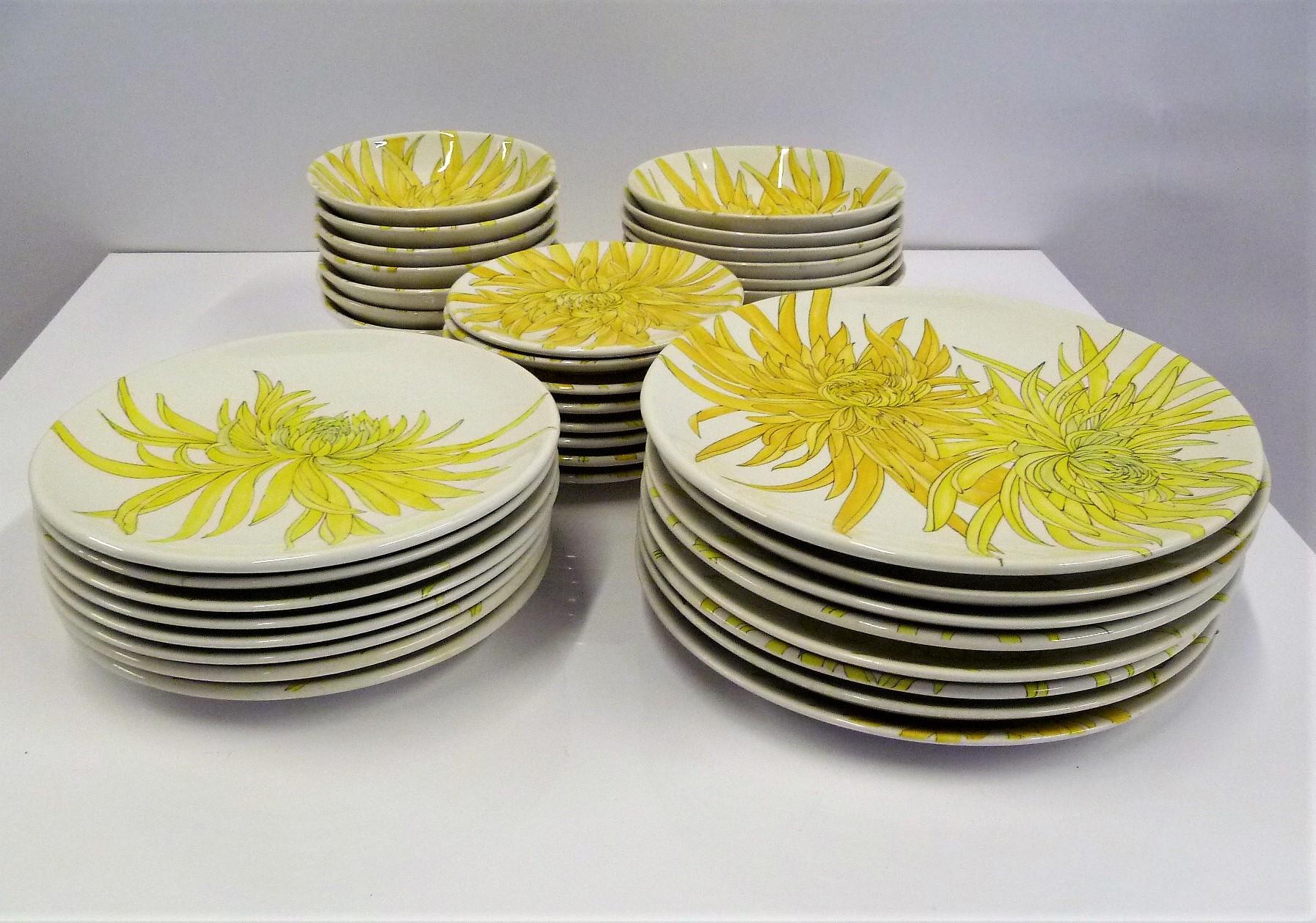 Almost an 8 place settings of hard to find Ceramiche Ernestine hand painted dinnerware made in the 1950s in Northern Italy. The Chrysanthemum pattern P14 is colorful and visually very pleasing with its flowers almost covering the entire plates and a