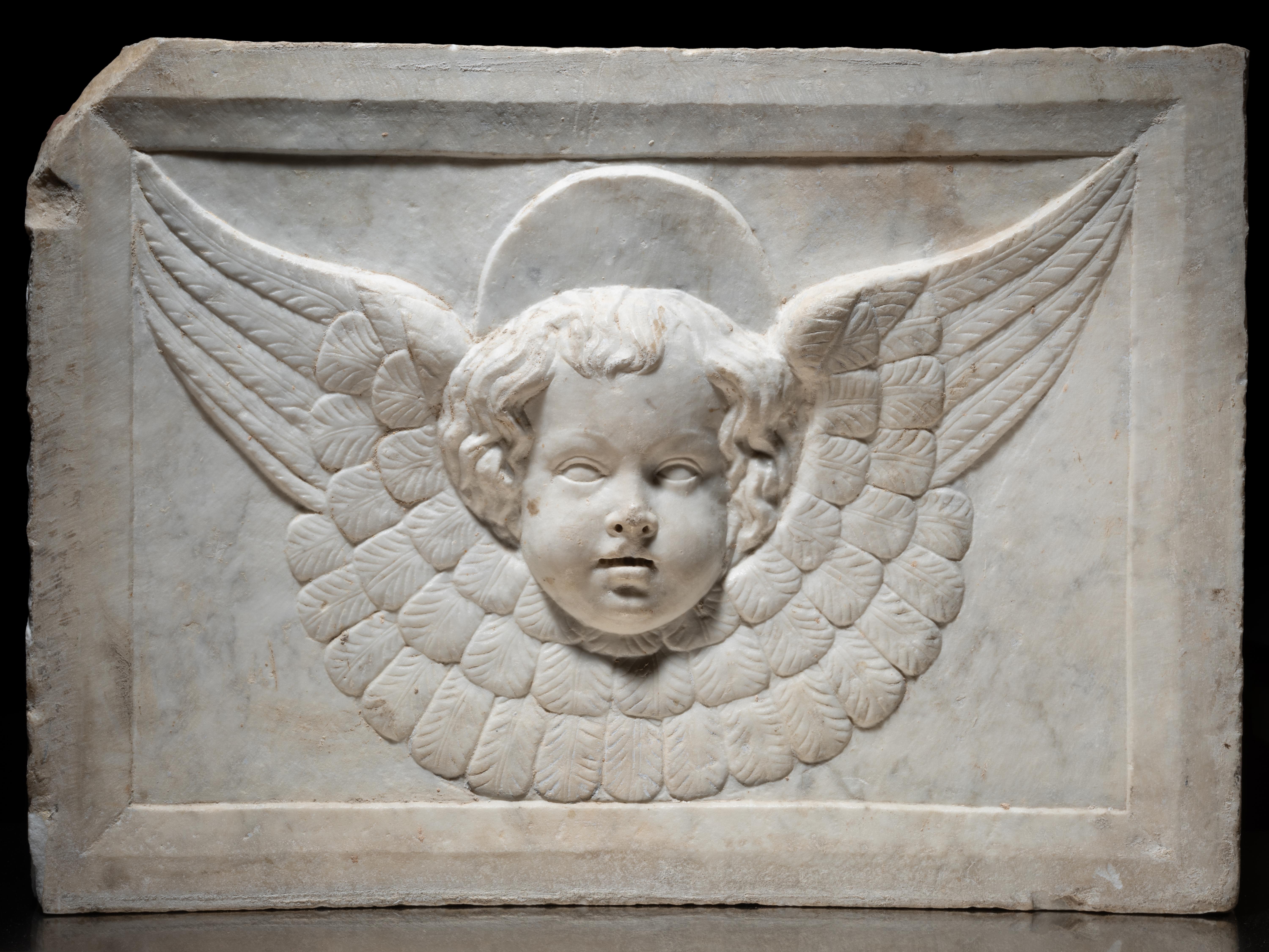 Carved Cercle of Jacopo della Pila - Marble relief depicting a winged Cherub For Sale