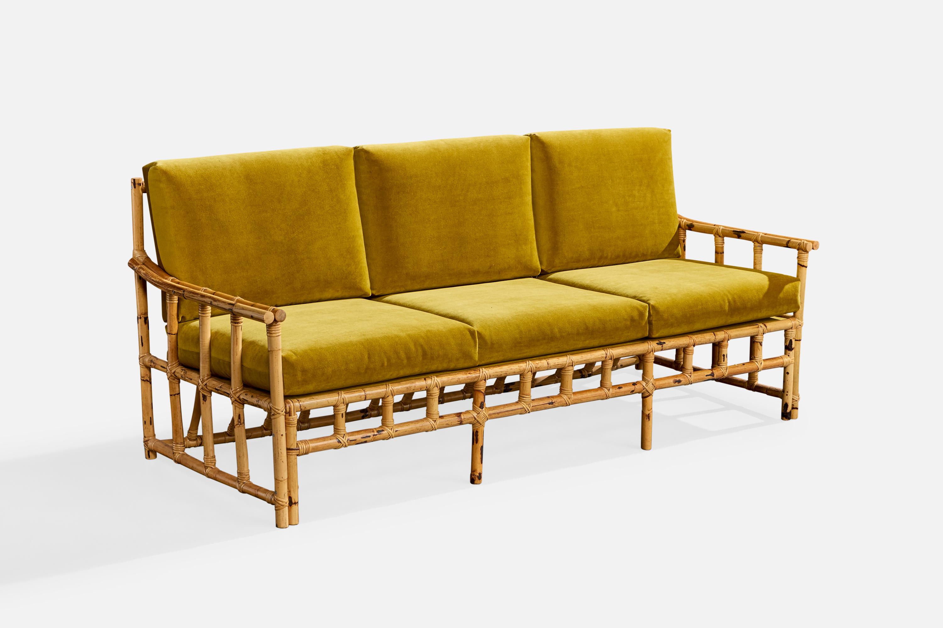 A bamboo, rattan and green velvet sofa produced by Cerdá, Spain, c. 1950s.

Cushions reupholstered in brand new velvet.

Overall Dimensions (inches): 32.75
