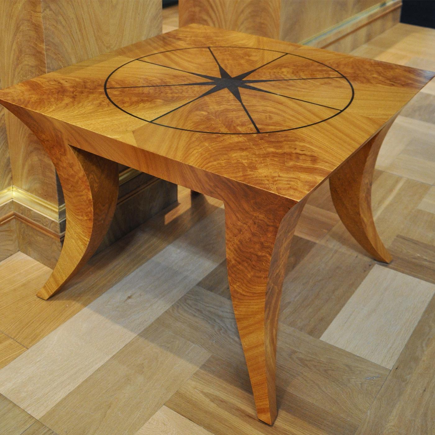 This classy coffee table exudes the indisputable allure of a furniture gem, since it is fashioned from an ultra-rare timber - Cerejeira crotch wood. Its dynamic shape combines thick plans and full volumes, including the sculptural legs shaped like