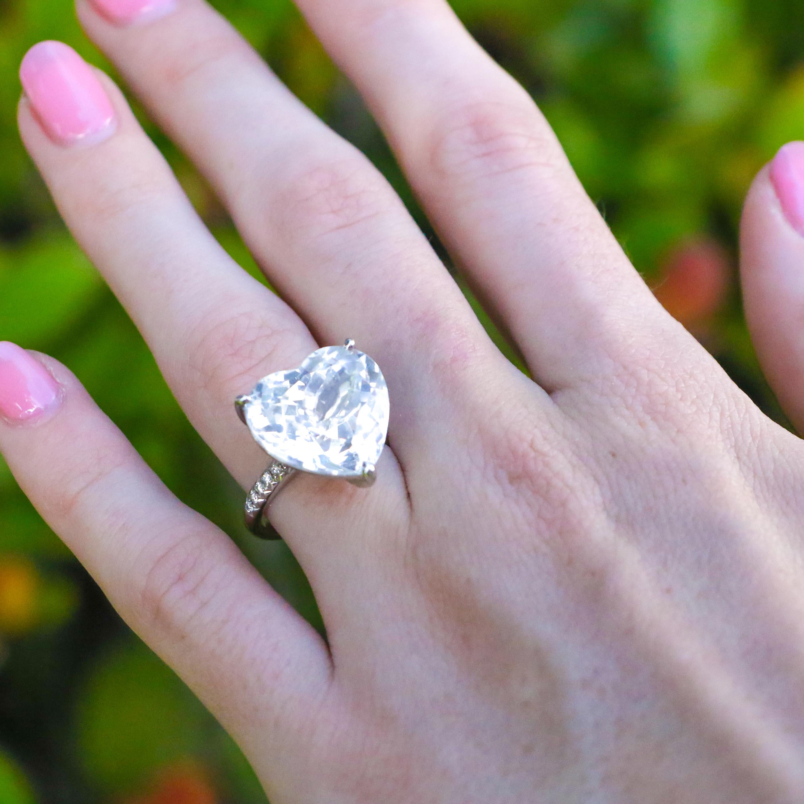 Certified White Topaz = 16.34 Carat 
Diamonds = 0.12 Carats
Metal: 18K White Gold
Ring Size = 6
It can be resized complimentary