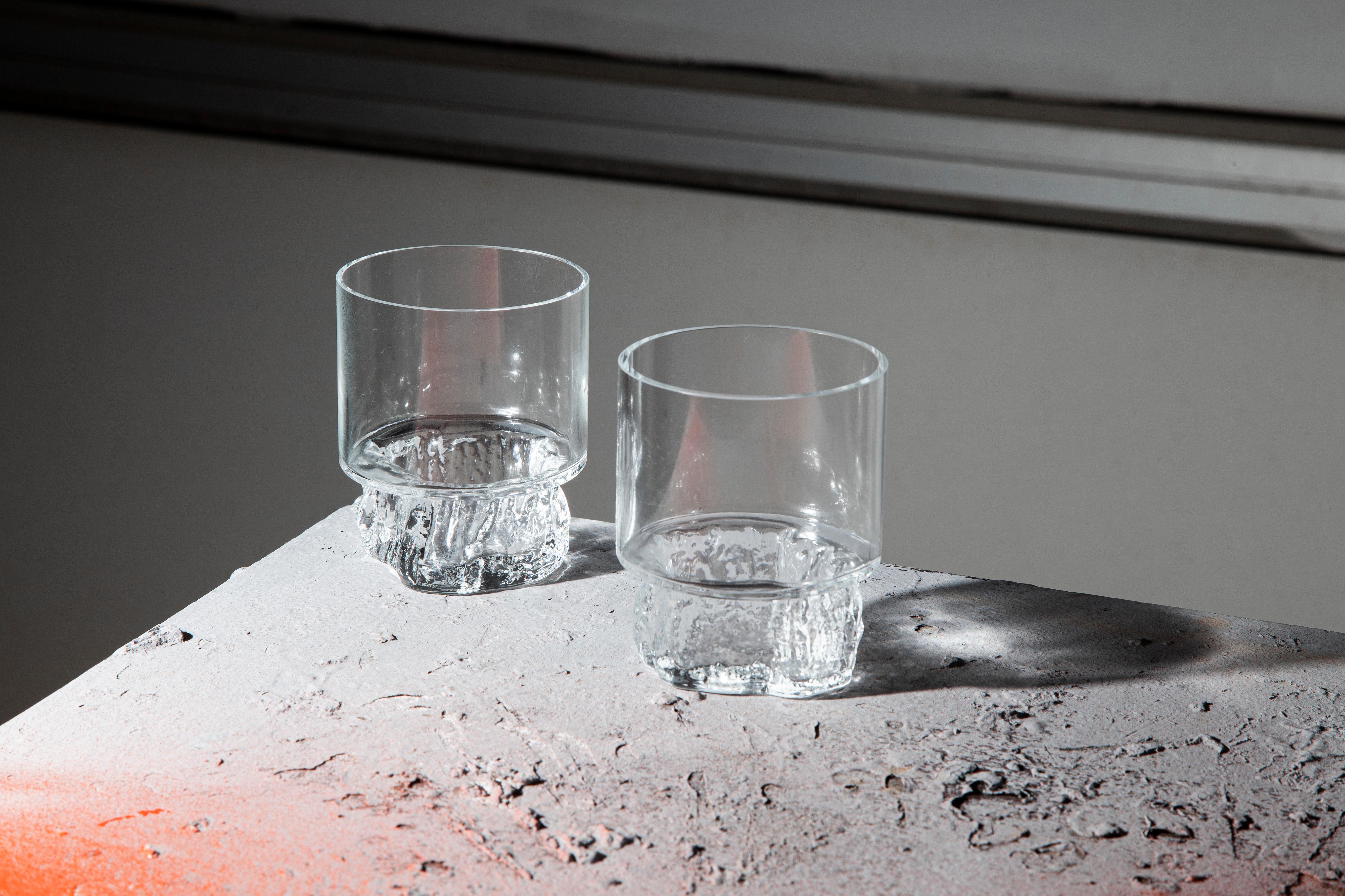 Cerne - meaning the tree's heartwood - is the name of this glassware set composed by two glasses and one bottle, which comes with an elegant carob wood and cork lid. Designed by Samuel Reis and handmade in Portugal, Cerne comes into shape by blowing