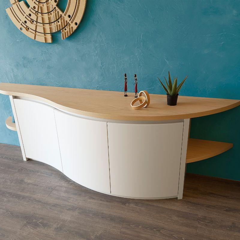 Original high-end sideboard, with white curved doors and light oak wood top. Generous in size (almost 3 meters) and with a particular shape, it's suitable for furnishing. The round shape and the total absence of edges, allow it to be placed even on