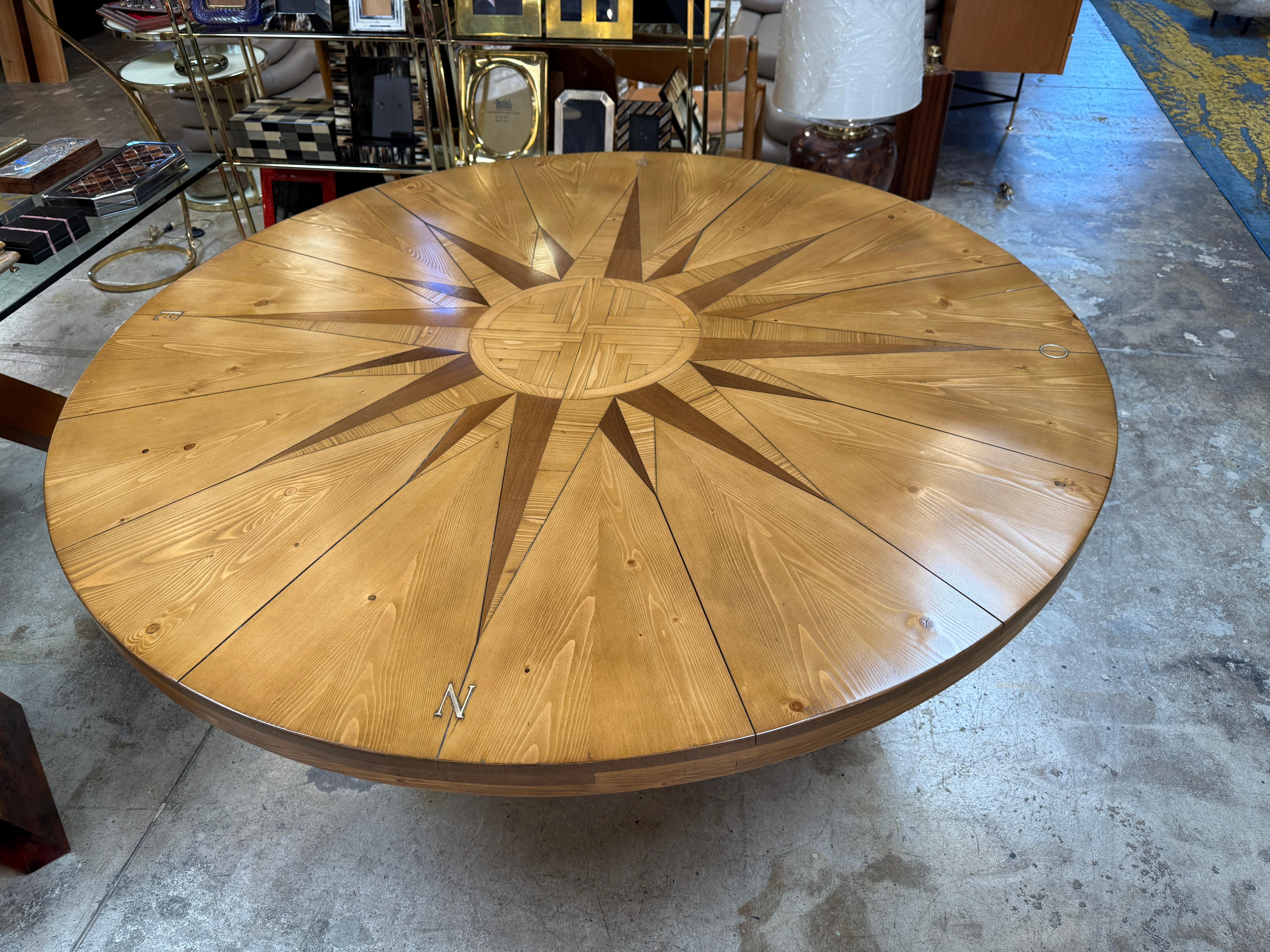 The 1st EDITION Large Rosa dei Venti table, designed by the renowned artist Mario Ceroli in the 1970s and crafted by Poltronova, is a truly remarkable piece of art and furniture. This exquisite table is characterized by its exceptional craftsmanship