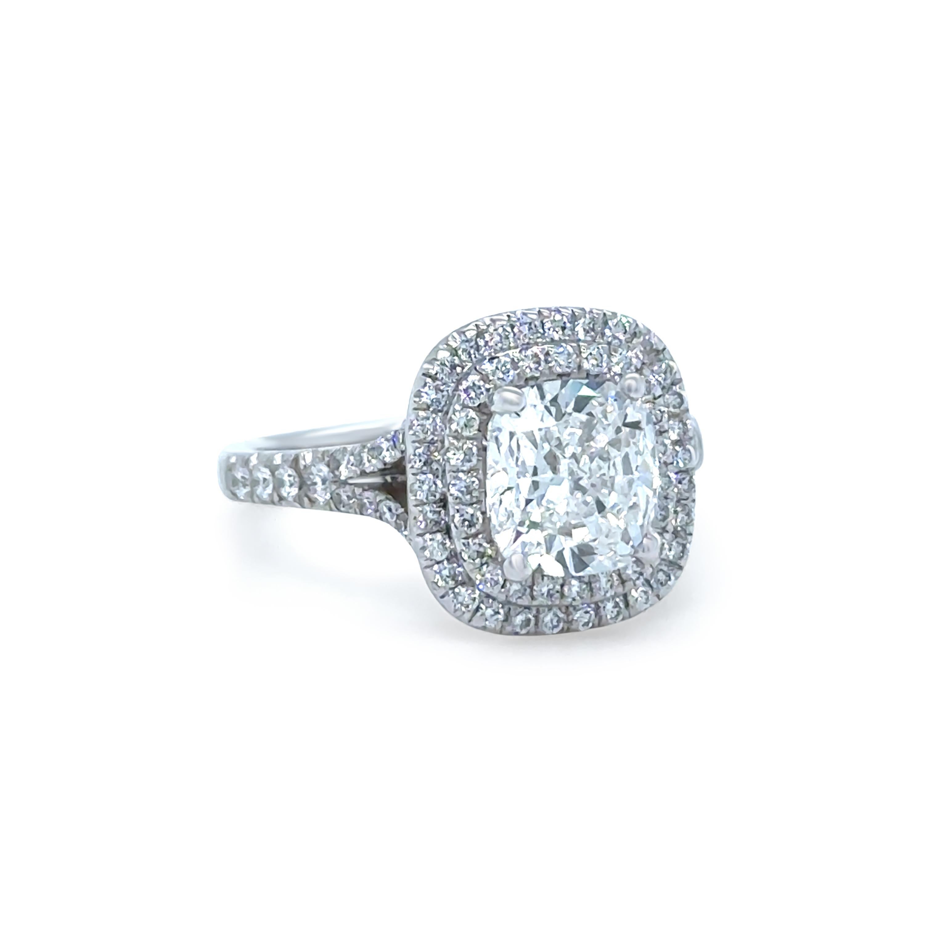 A spectacular creation by renowned Australian jeweller Cerrone, this handmade double halo diamond ring is crafted in 18ct white gold and showcases a stunning GIA Certified 1.80ct cushion cut diamond in a secure four-claw setting. The centre stone is