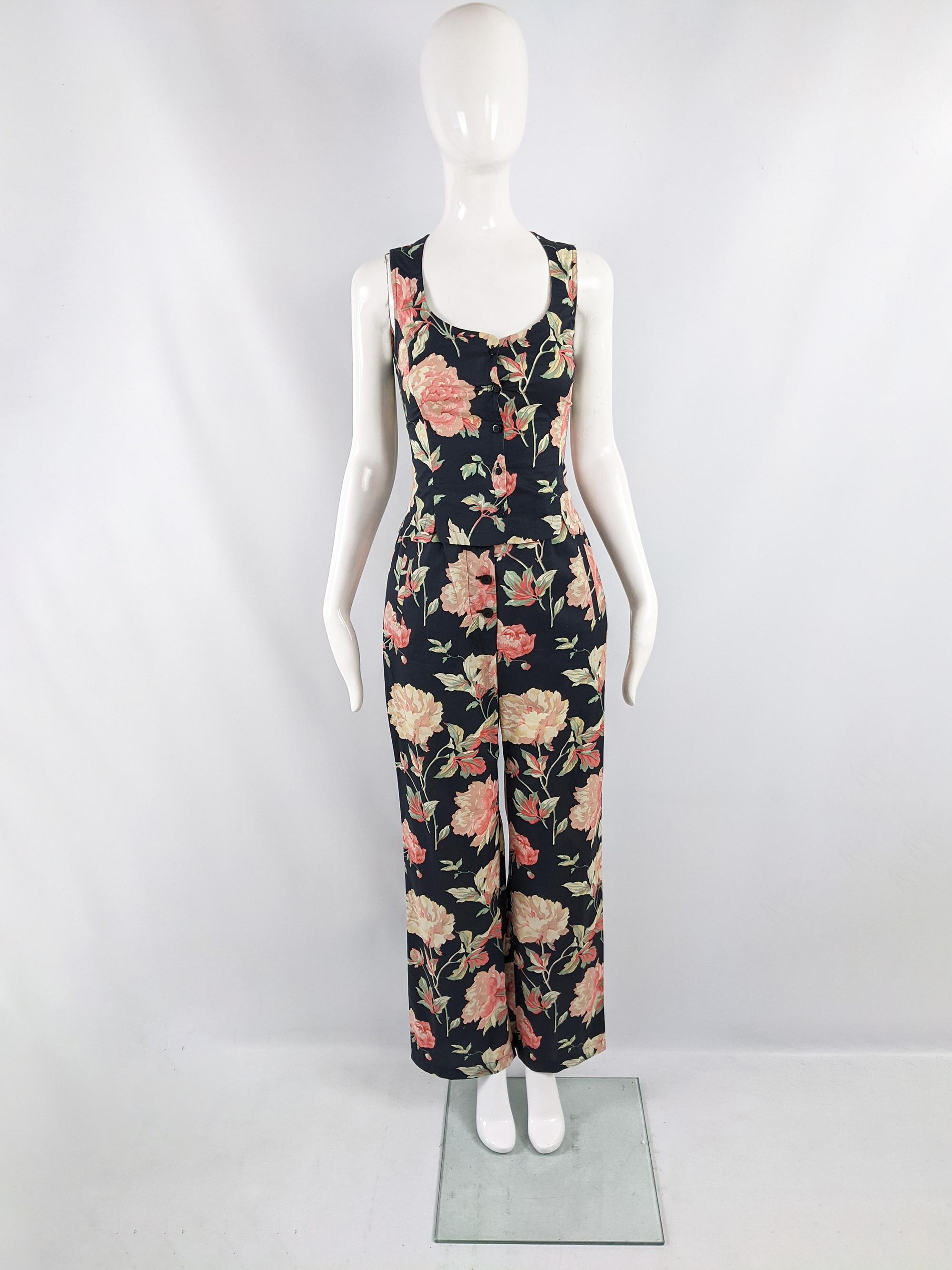 An amazing vintage womens two piece trouser suit from the 90s by luxury Italian label, Cerruti 1881. In a black cotton with a bold pink floral print throughout. Consisting of a sleeveless jacket / vest and high waisted, wide leg pants. 

Size: The