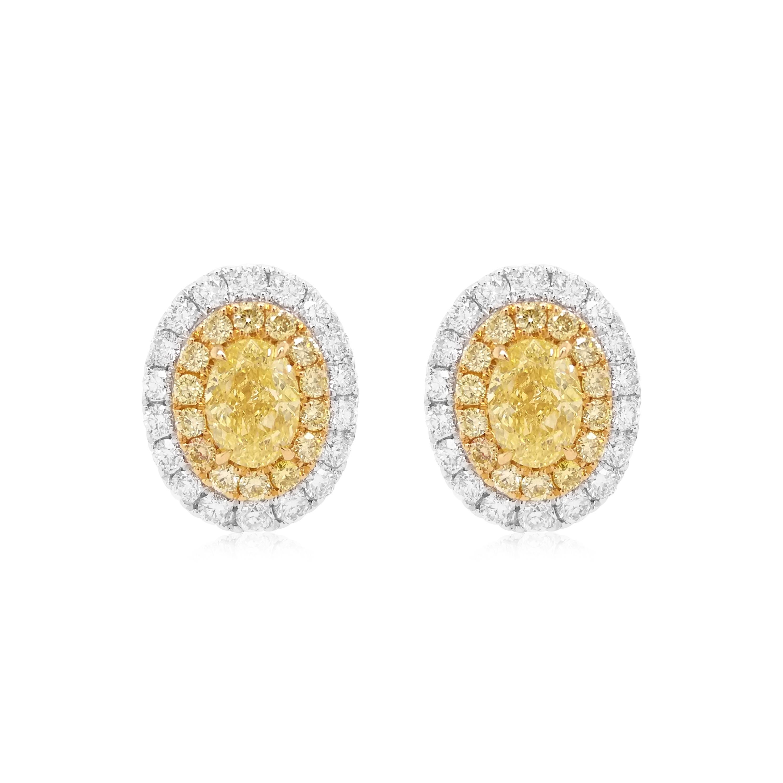 Beautiful stud earrings with GIA-certified Oval Shape Natural Yellow diamonds 

Fancy yellow diamond - 0.52 cts (GIA Certified)
Fancy yellow diamond - 0.54 cts (GIA Certified)
Round Brilliant Cut Yellow Diamonds - 0.14 cts
Round Brilliant Cut White