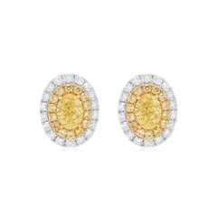 GIA Certified Oval Cut Natural Yellow Diamond and White Diamond Earrings