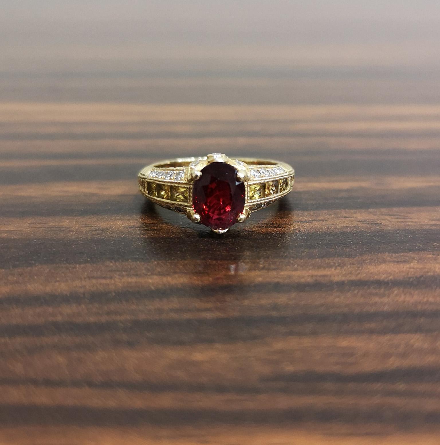 A fabulous, beautifully decorated and elaborate ring. The exceptional central red spinel of fantastic colour and fire is mounted in four claws. Flanked on either side by a channel of French-cut yellow sapphires. The gallery set with diamonds and