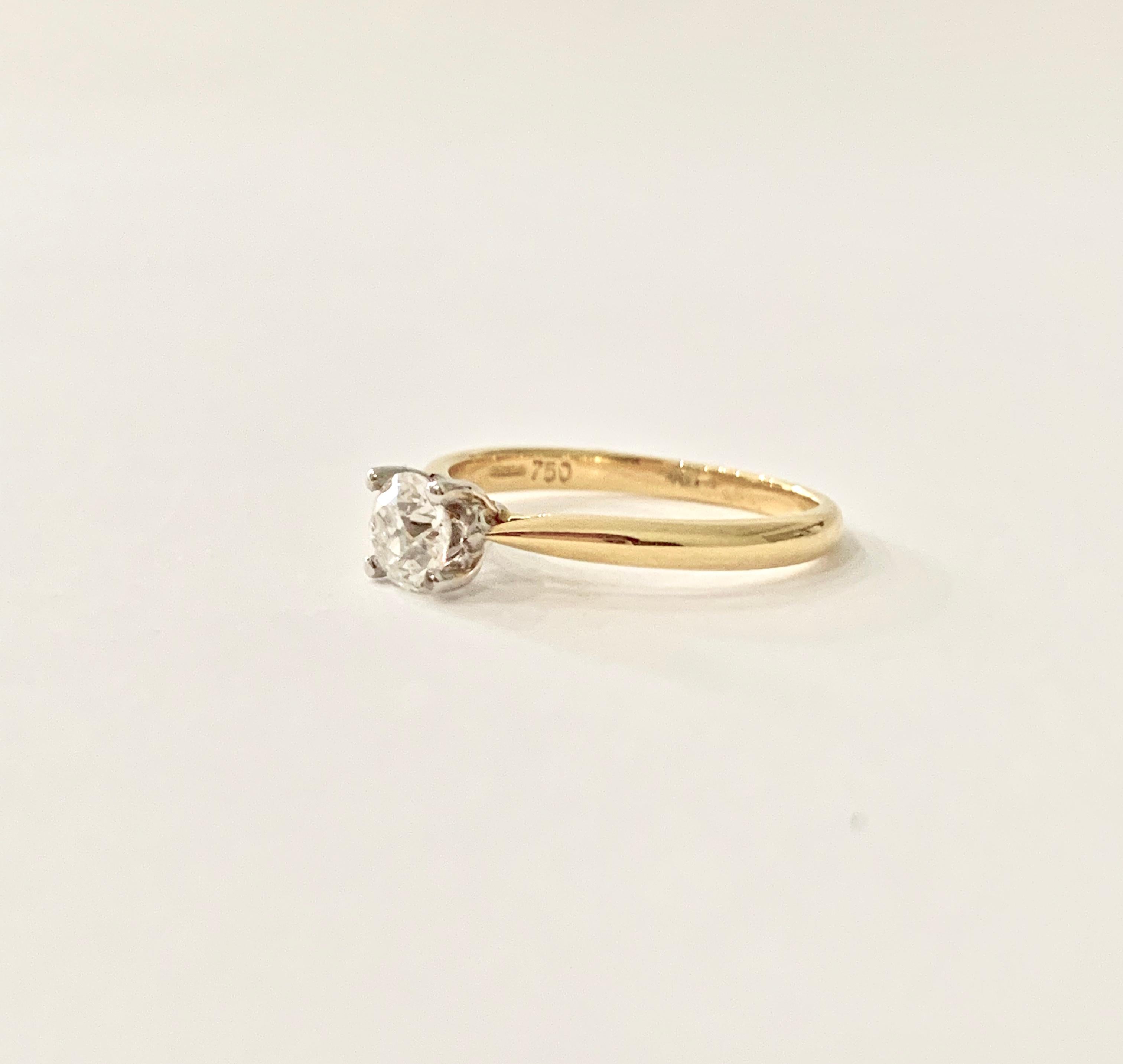 This beautiful Old Cut* 0.53ct Diamond in set in a very classic but very sought after four claw design in 18ct Yellow Gold.  The diamond is Certified by WGI (London) as being G in colour and VS2 in clarity, the stone has the higher and smaller table