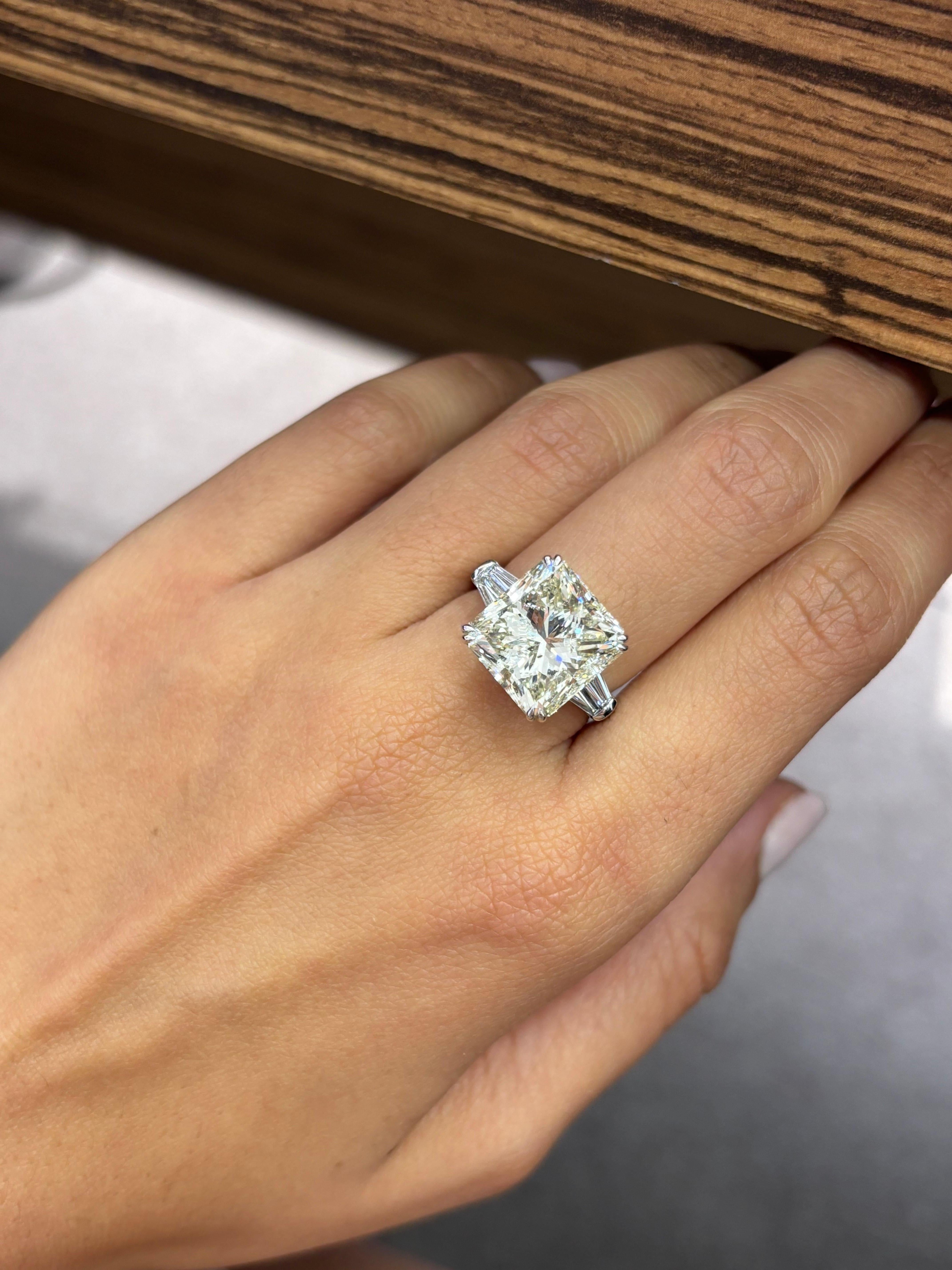 Make a statement with this beautifully crafted 10.16 carat radiant cut Diamond, set in solid 18K White Gold. The center stone natural Diamond is certified, L color, SI2 clarity. But the stone is a of a great SI qaulity, with no obvious inclusions to