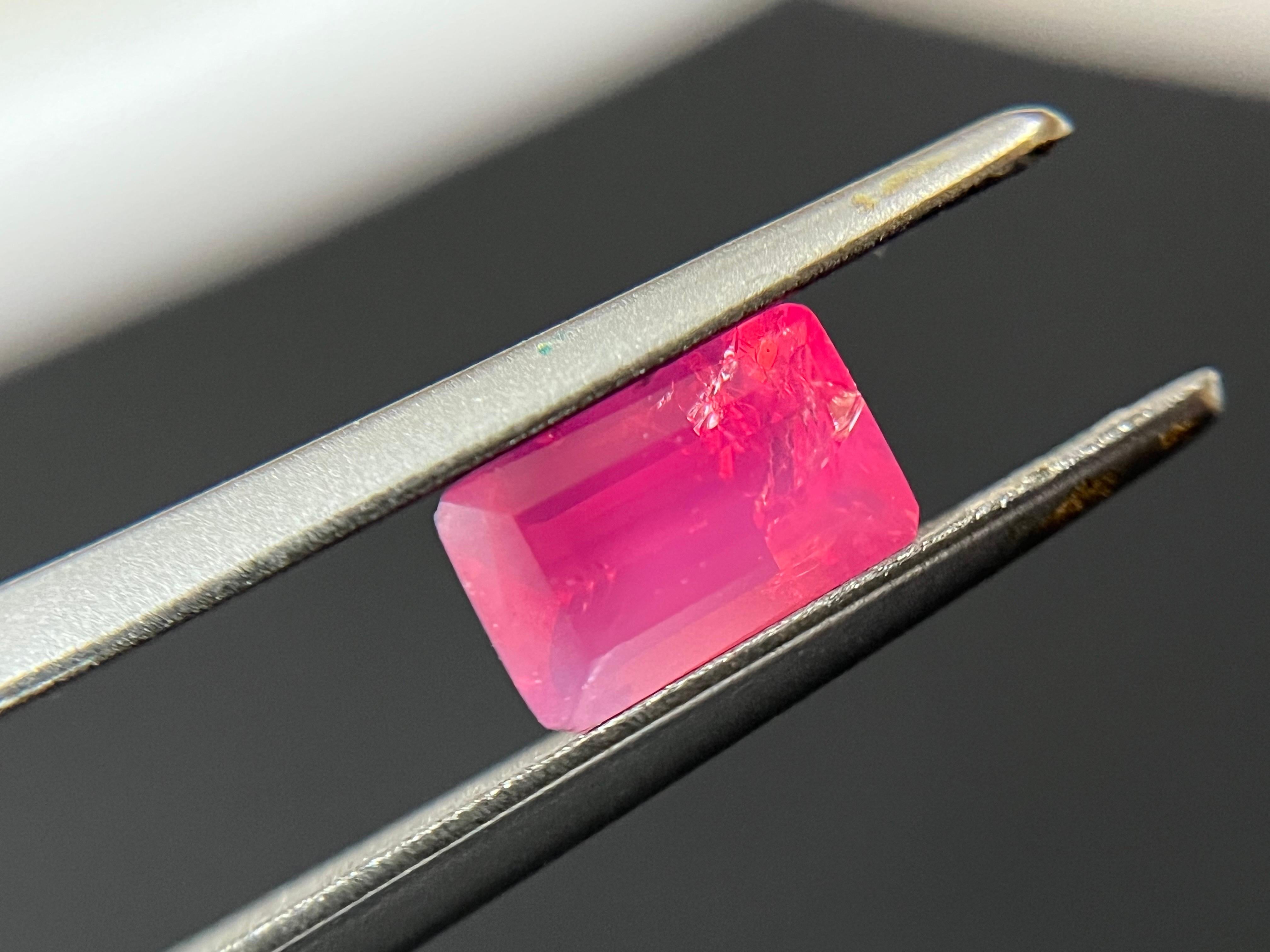 Introducing our exceptional Mahenge spinel with a silky body neon pink color and orange fire that is truly one-of-a-kind. This gemstone is a marvel of nature, with its rare and captivating hue that exudes warmth and vitality.

Sourced from the