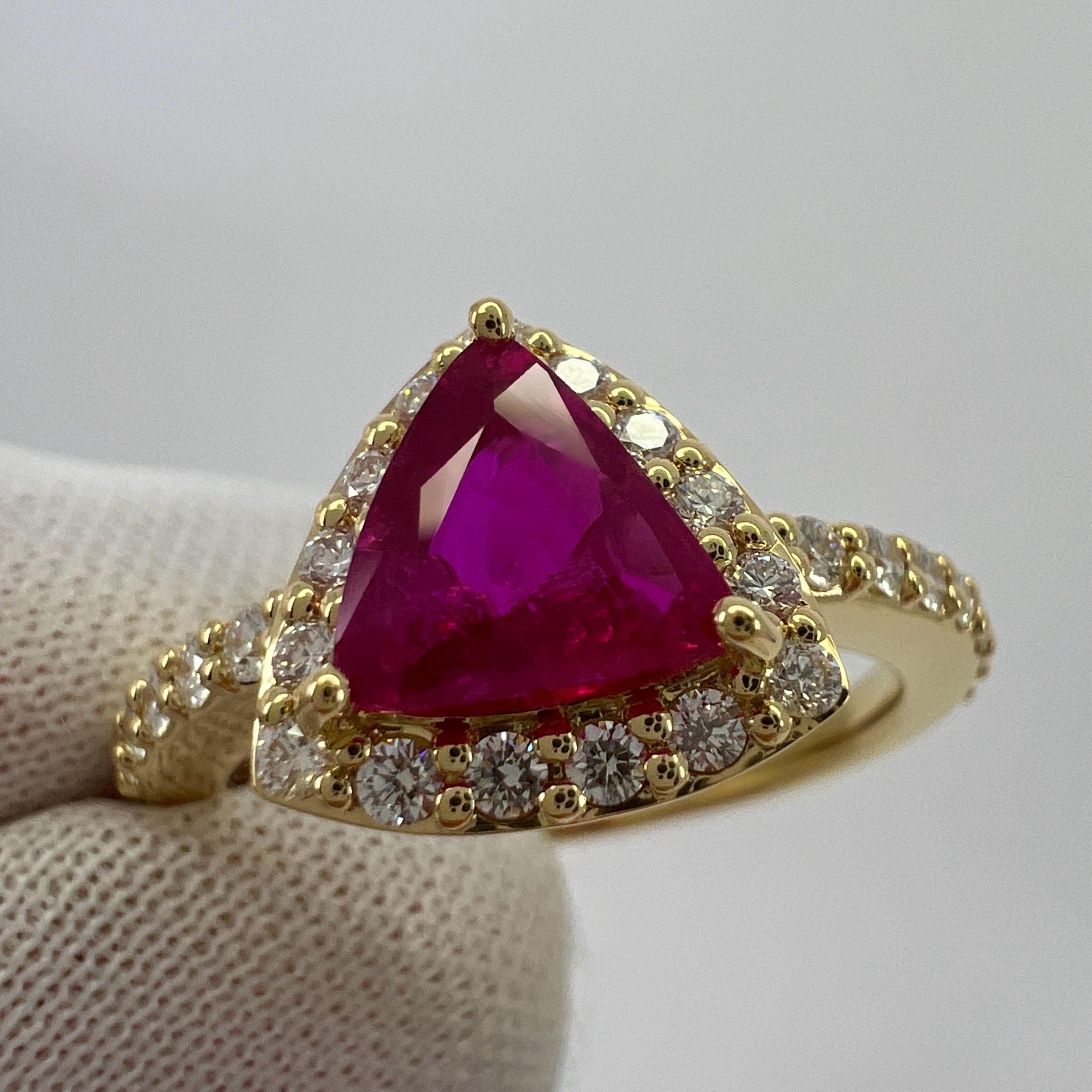 Natural Vivid Pinkish Red Untreated Ruby & Diamond 18k Yellow Gold Triangle Cut Cluster Halo Ring.

1.02 Carat vivid pinkish red triangle cut unheated natural ruby set in a finely made 18k yellow gold cluster ring. 
This ruby has a beautiful vivid