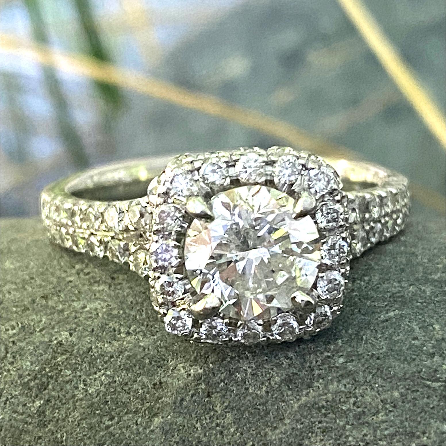 A bright round diamond gets the sparkling setting it deserves with this beautiful soft square halo ring by Eytan Brandes.  

Split shoulders create a bit of openwork interest on the sides and enhance a clean line from the face of the ring, to the