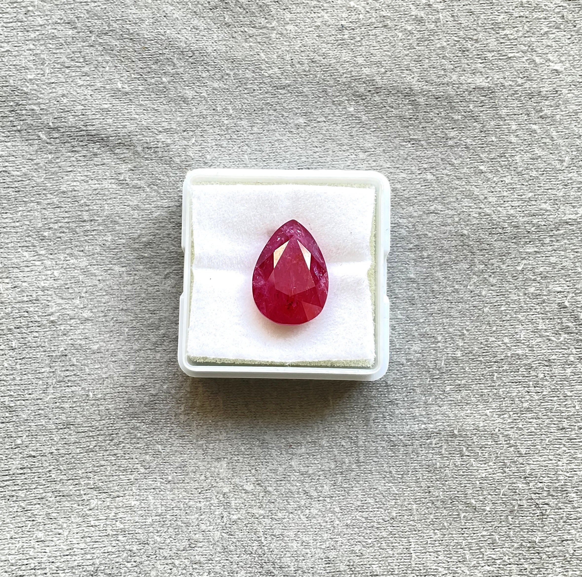 As we are auction partners at Gemfields, we have sourced these rubies from winning auctions and had cut them in our in house manufacturing responsibly.

Weight: 10.44 Carats
Size: 15x11x7 MM
Pieces: 1
Shape: Faceted Pear