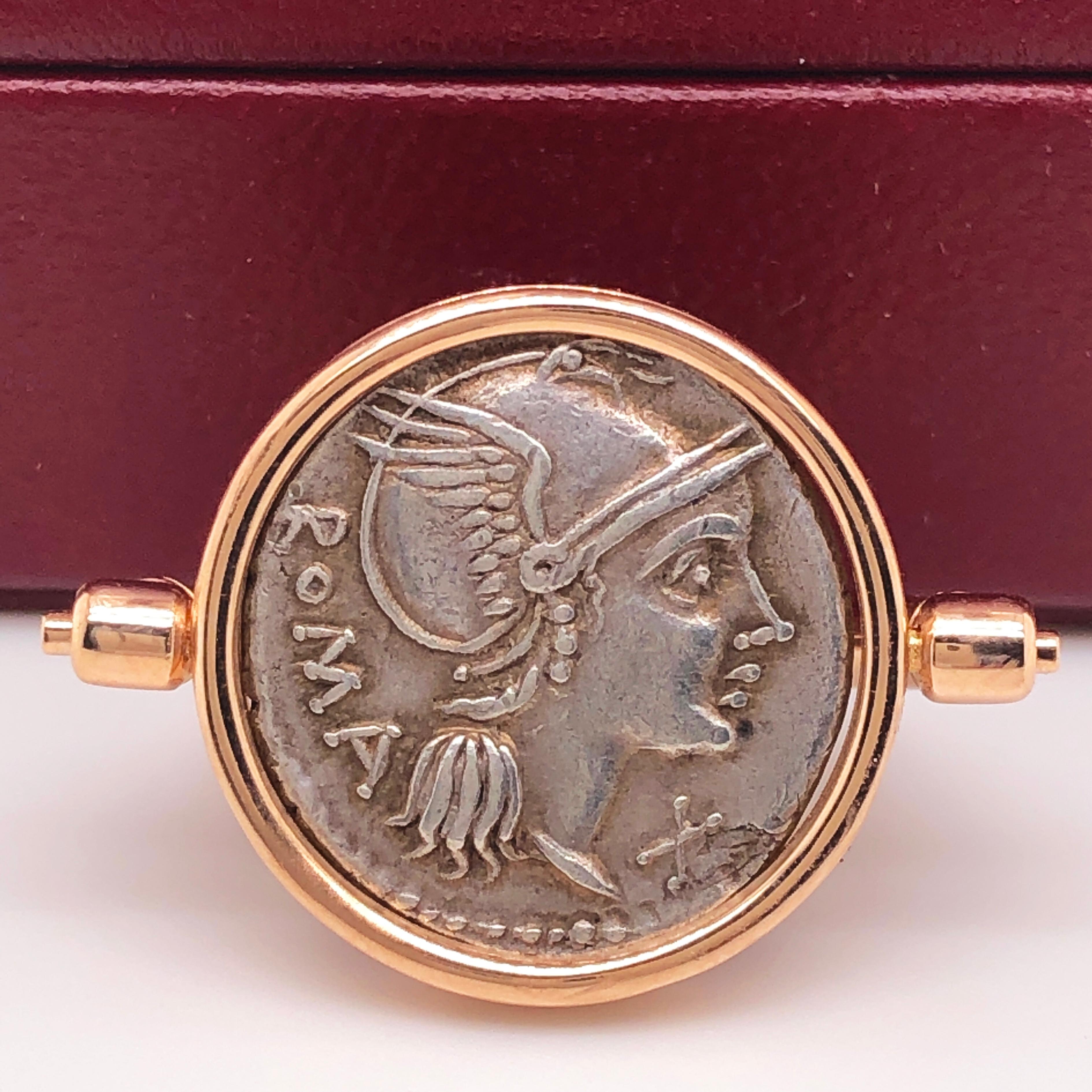 Original and One-of-a-kind 109-108 B.C. Gens Flaminia Silver Coin(DENARIO) featuring on the front Roma's Head wearing a Helmet and Victoria Dea on a Chariot on the back in an 18Kt Rose Gold Rotating Setting. Gens Flaminia (one of the most important