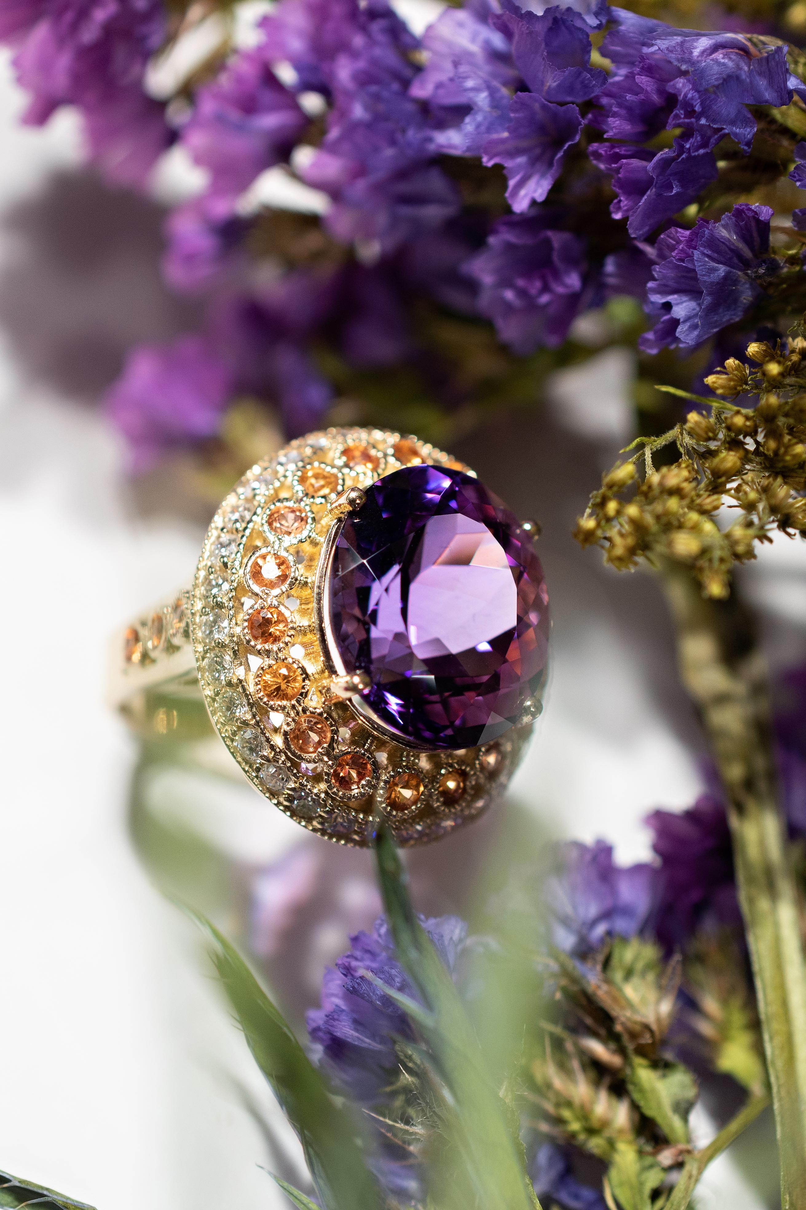 Stunning wearable piece of art! 
10ct Purple Amethyst centre stone surrounded by diamonds 1ct and orange sapphires 1.2ct. Set in 14k yellow gold. It is the perfect 