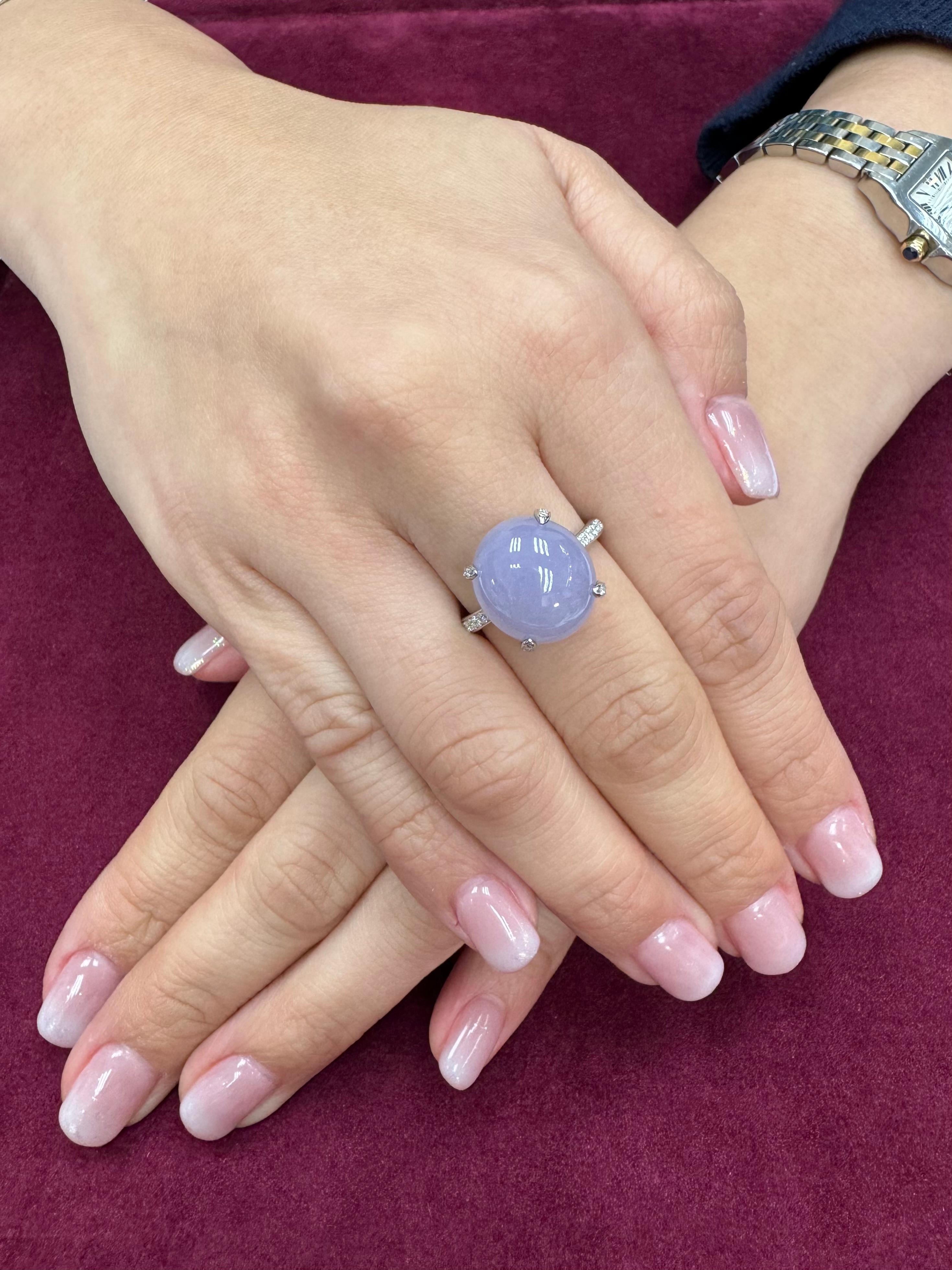 Please check out the HD Video! Here is a very eye pleasing lavender jade and diamond ring! It is certified natural jadeite jade. The ring is set in 18k white gold and diamonds. The center lavender jade cabochon is large at 11.36cts and measures