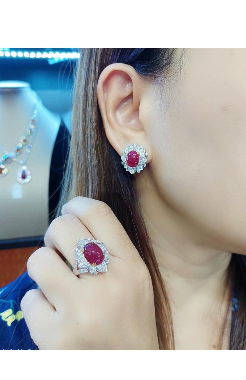 Introducing an exquisite set of jewelry featuring striking vibrant rubies and dazzling diamonds.
This captivating parure includes a stunning ring and earrings , crafted to perfection.
Each piece showcases the vibrant allure of the brilliant red