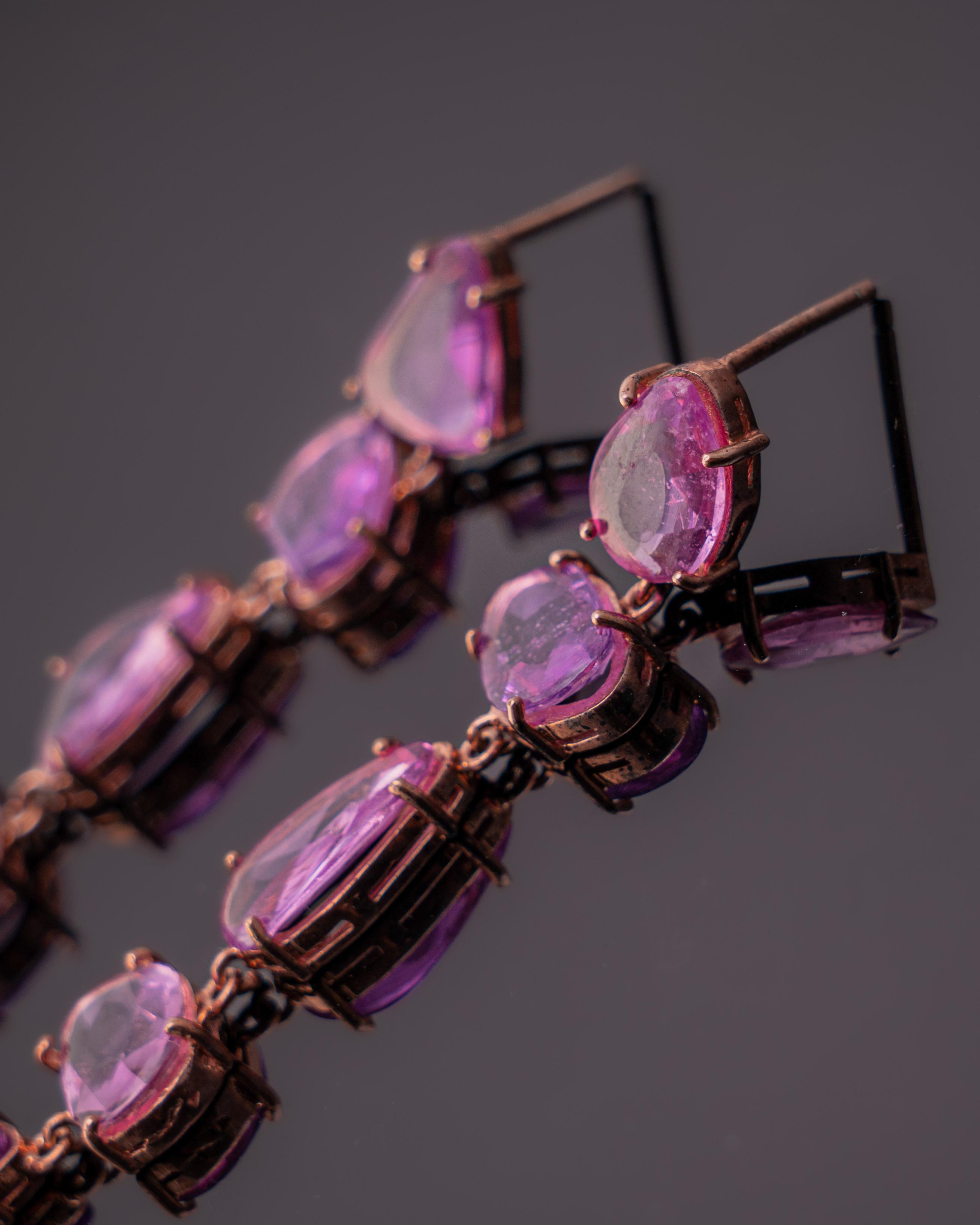 A very dainty and beautiful pair of Rose Cut Pink Sapphire Drop Earrings set in 18K Rose Gold. The weight of the 10 pieces of Pink Sapphires is 12.1 carats. The Pink Sapphires Rose Cuts are sourced from Madagascar. The weight of the pink Gold is