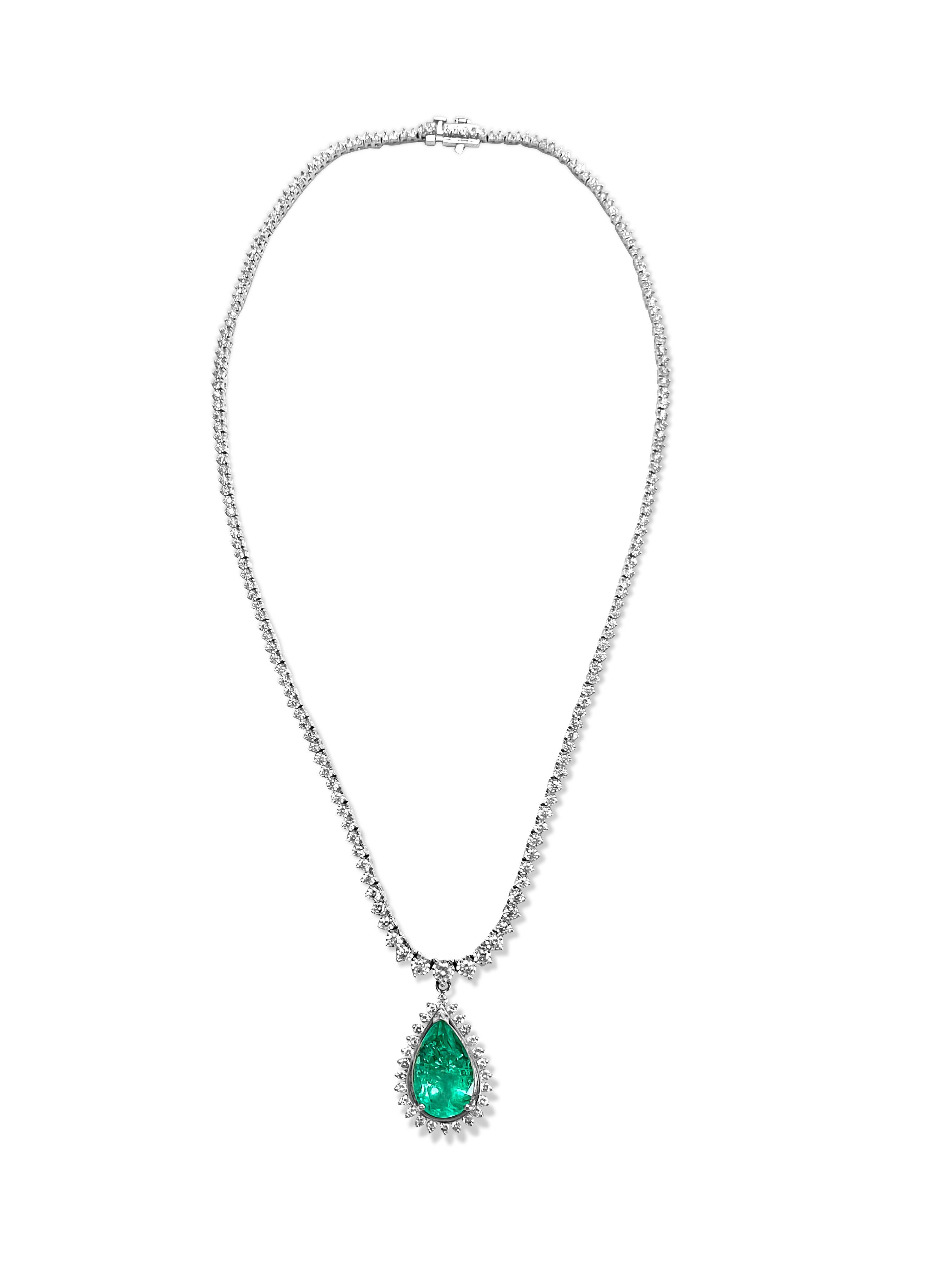 Metal: 14K White Gold. 
7.50 Carat Diamonds, Round Brilliant Cut, VS-SI Clarity, F-G Color. 

12.00 carat emerald, pear Shape. 100% natural earth mined Colombian emerald. Nice saturation and color. 
All diamonds and emerald are set in prong setting.