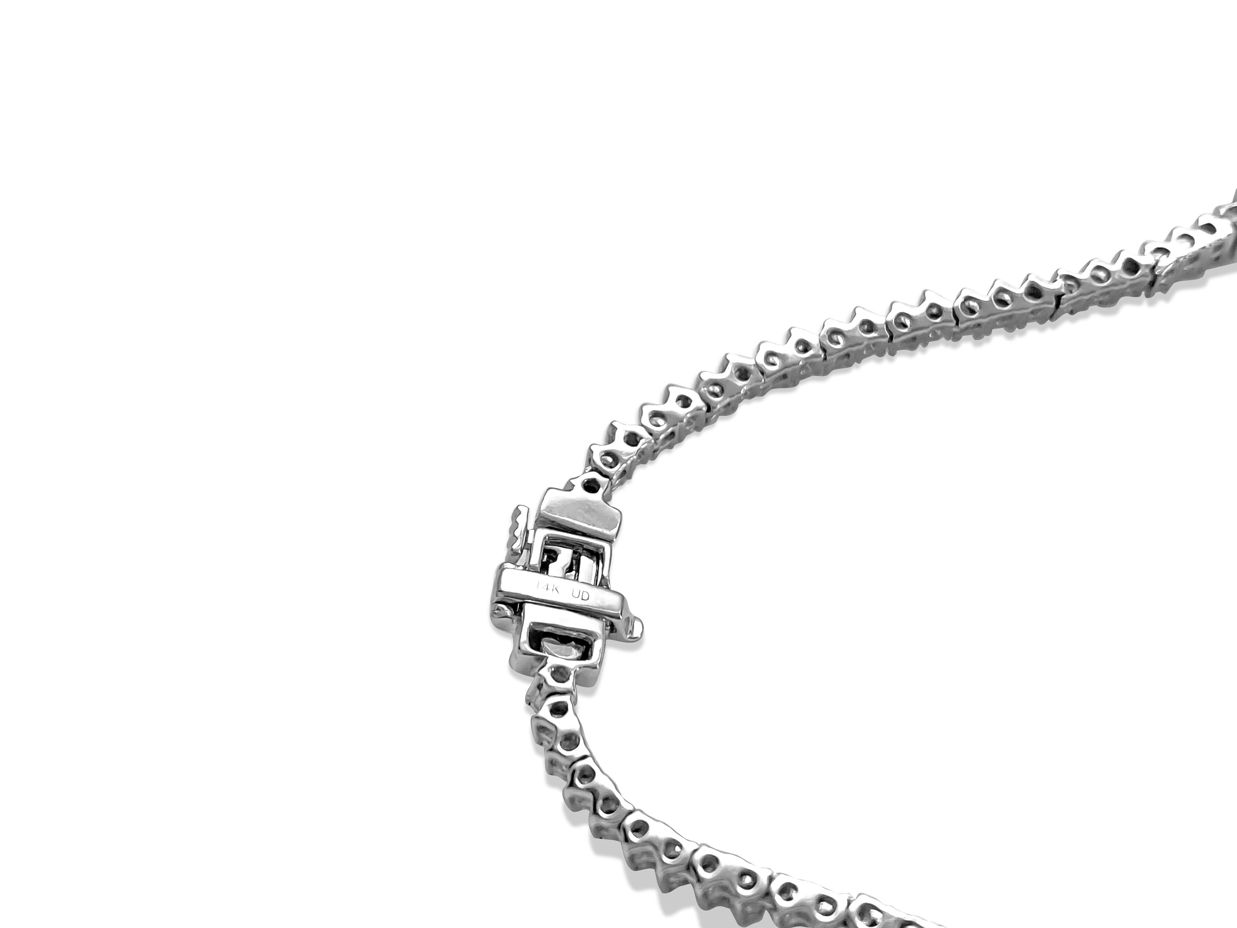 Discover an exquisite piece of jewelry that transcends elegance - a one-of-a-kind women's emerald necklace, meticulously crafted in 14K White Gold. Certified by GIA graduate gemologist, AGI NY, this extraordinary piece holds a retail value estimated
