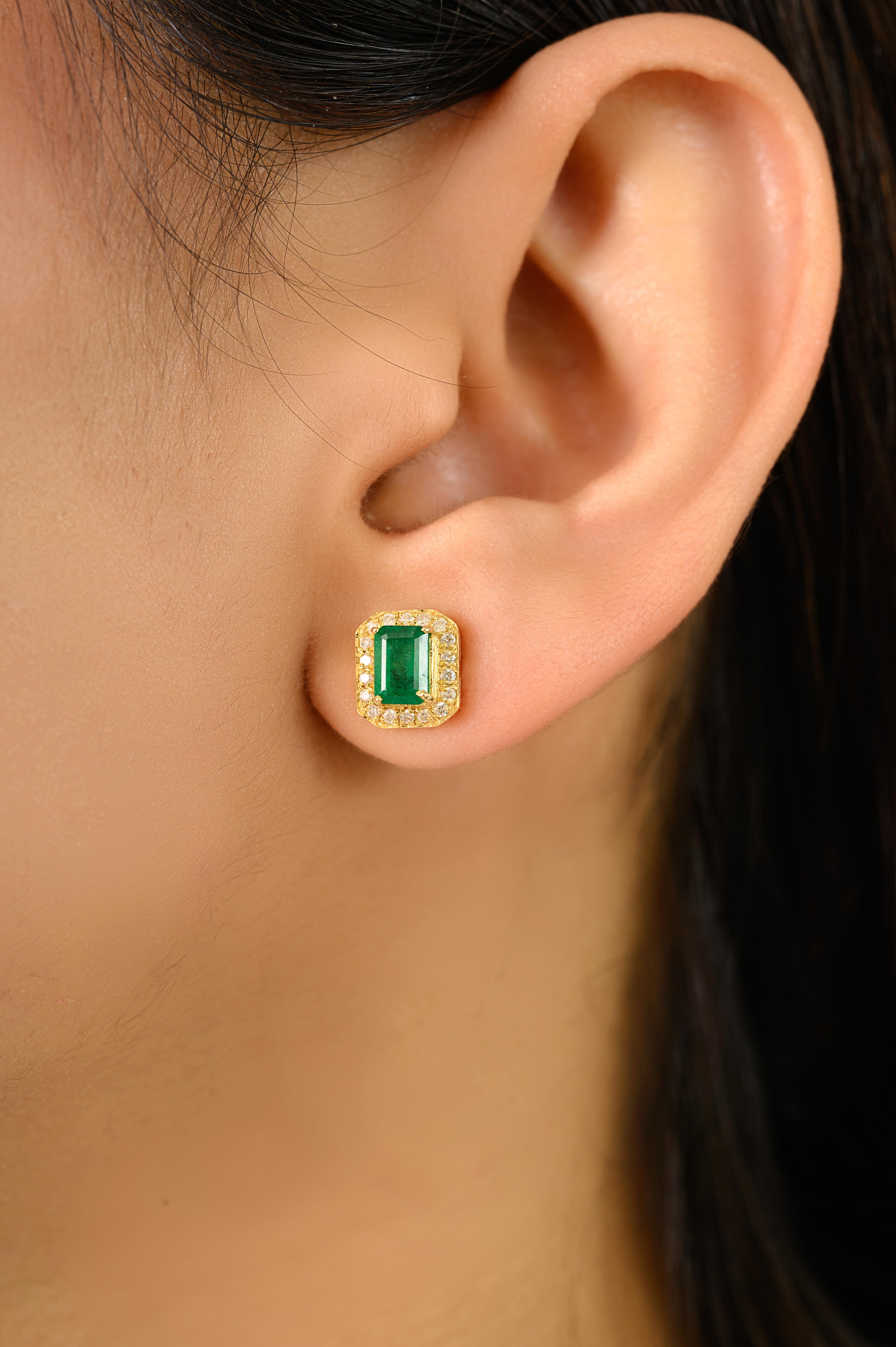 This Certified 1.23CTW Octagon Cut Emerald & Diamond Halo Stud Earrings in 14k Yellow Gold showcase natural emerald-cut emeralds 1.23 Carat surrounded by a sparkling halo of round brilliant-cut diamonds 0.25 Carat in a secure prong setting. Crafted