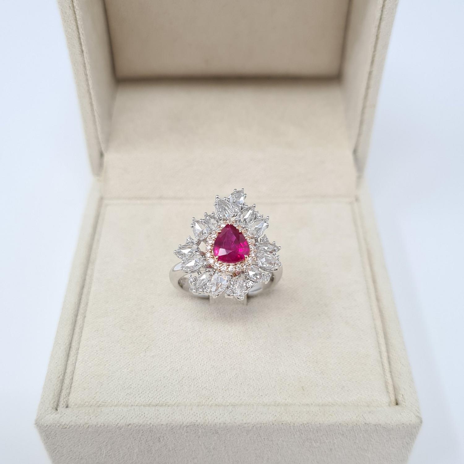 GRS Gemresearch Swisslab ruby certified superb modern important engagement ring. The ring consists of rose & white gold with 1.25 Ct natural ruby from Mozambique pear shape brilliant/step cut red color; 1.21 Ct white diamonds pears shape rose cut,