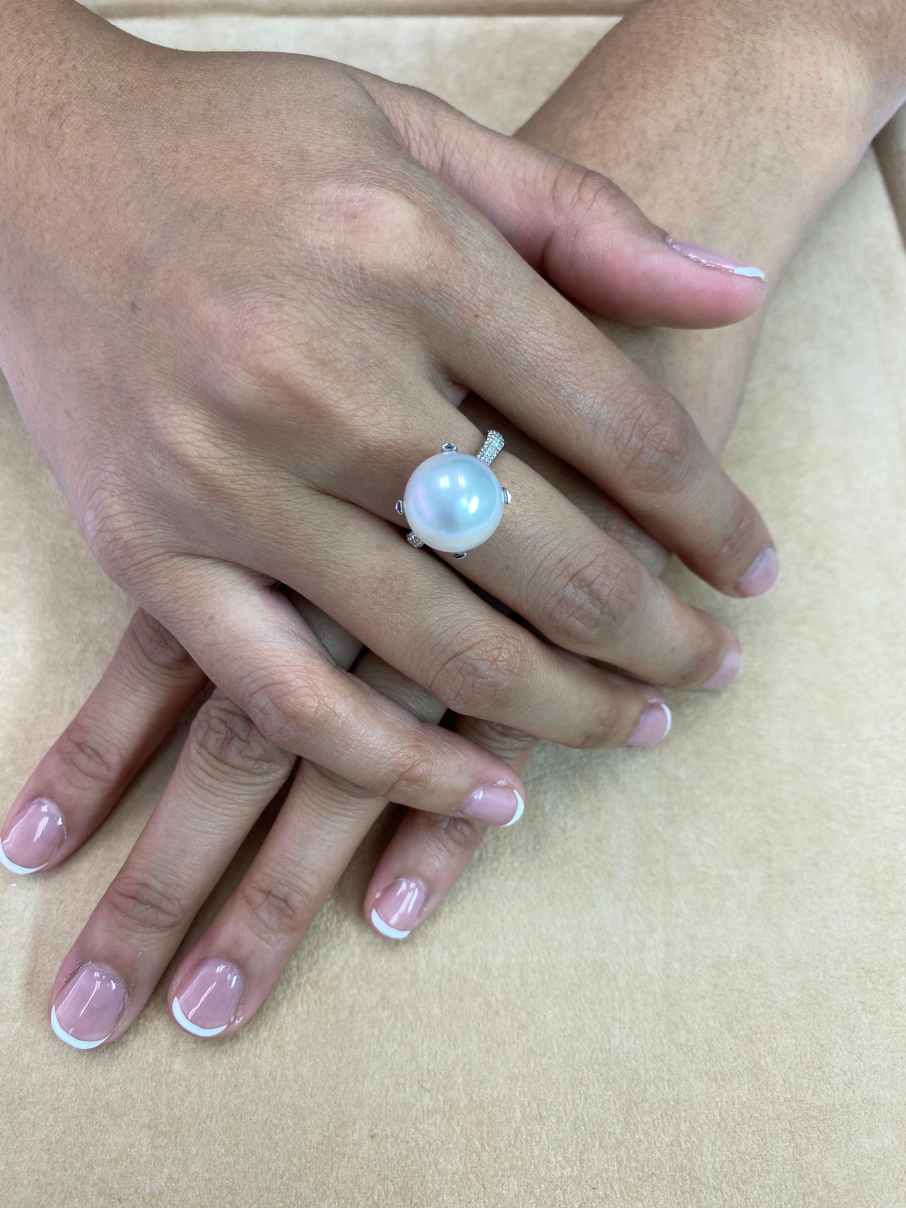 This is a certified South Sea culture pearl. The center pearl is 13.1mm. This high quality pearl is round, has beautiful skin and high luster. The color grading is silver white. The ring is set in 18k white gold. There are 0.28Cts of small diamonds