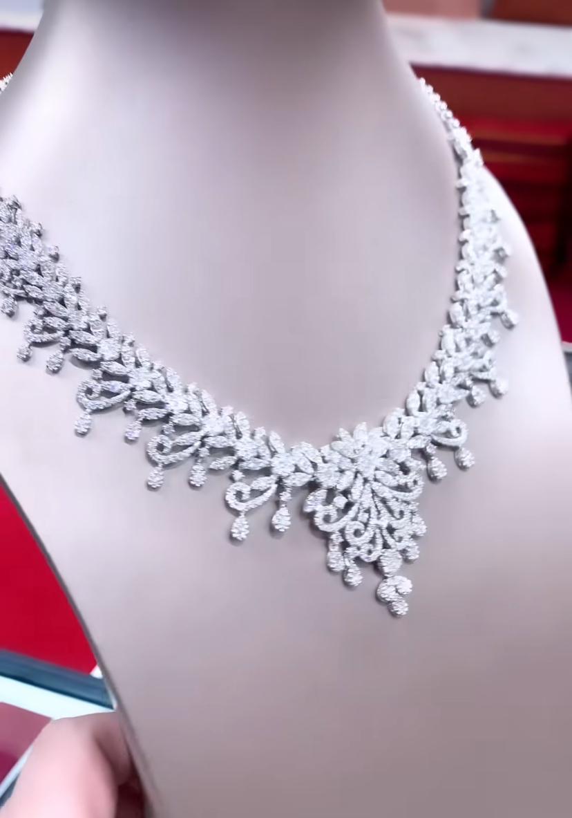 This exquisite masterpiece necklace is an epitome of luxury and elegance. The radiant diamonds, meticulously necklace in a stunning gold setting, create a mesmerizing display of opulence. Designed with versatility in mind, this necklace can be worn