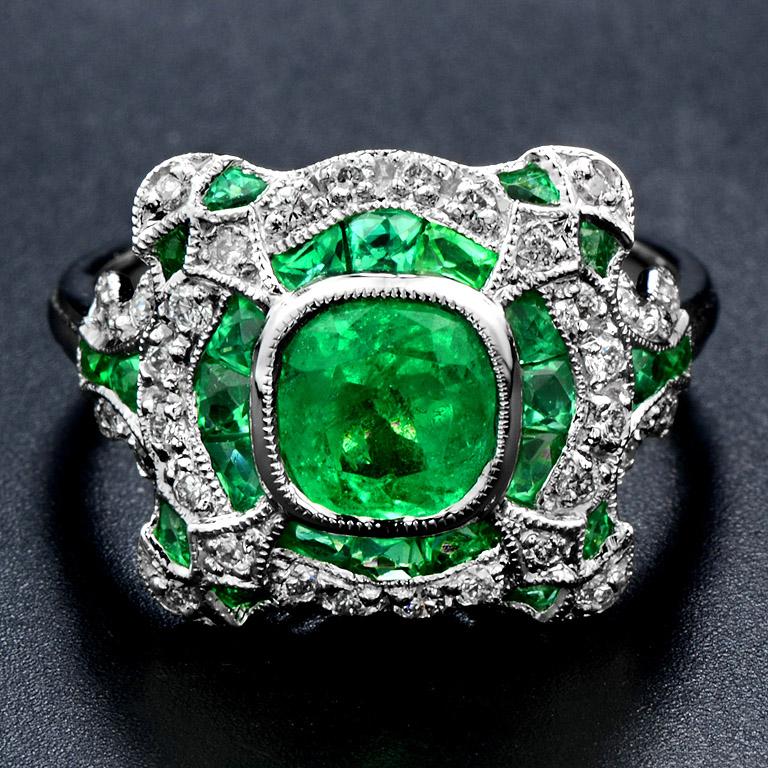 Certified 1.343 Carat Natural Emerald Cushion Shape and Fancy Cut from Colombia in the center with French Cut Emerald 24 pcs. 2 Carat and 36 pcs. 0.33 Carat Round Cut Diamond. 

This Ring was made in 18k White gold size US#7