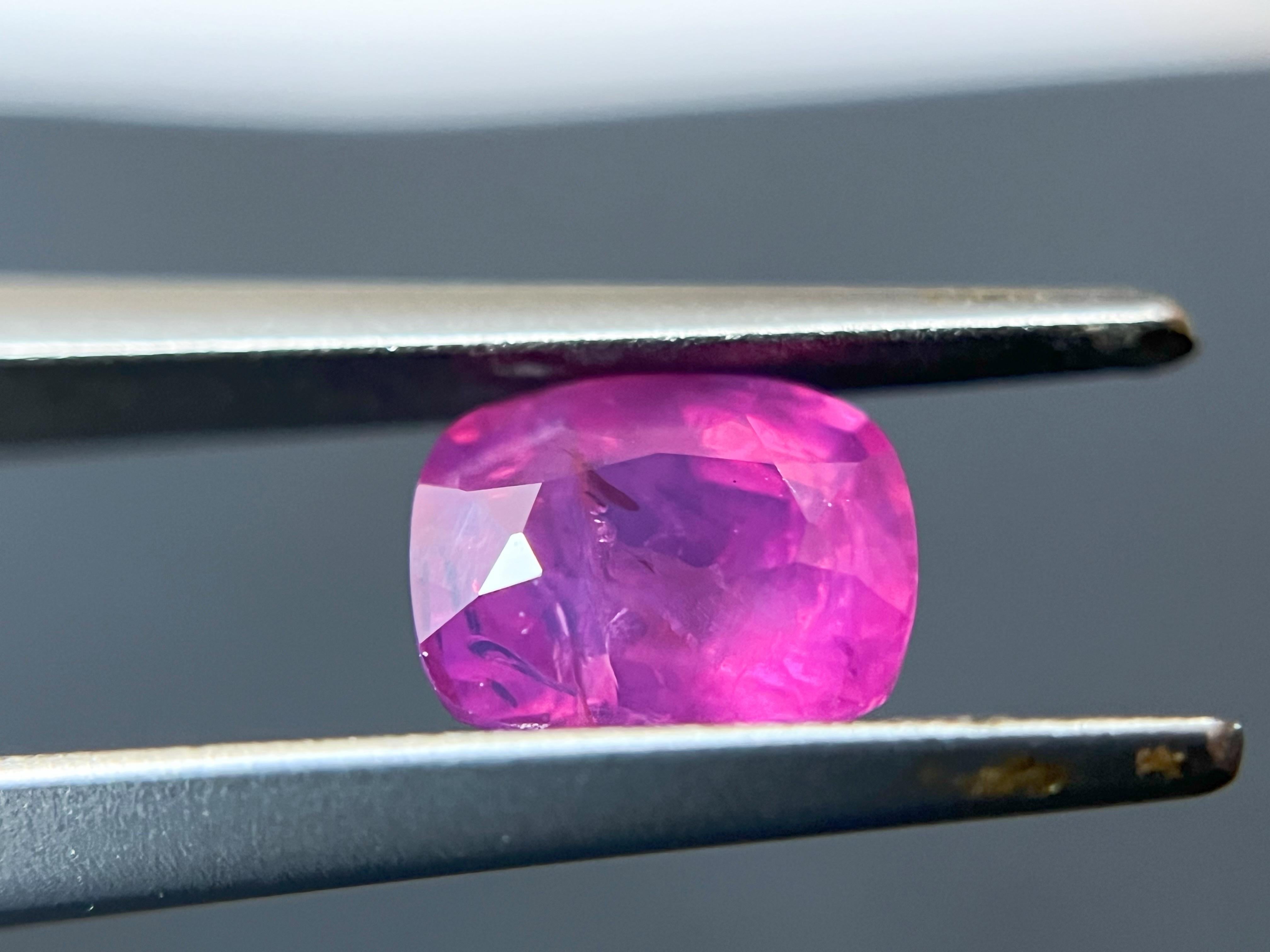 Introducing a stunning natural vivid pink sapphire, weighing 1.4 carats, that is sure to capture your heart. This gemstone boasts a vibrant and lively color that is simply breathtaking. Its vivid pink hue is completely natural, making it a unique
