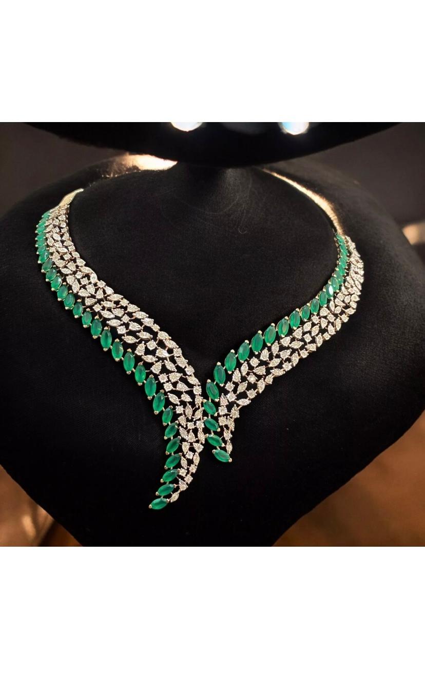 Elevate ypur elegance with our stunning emeralds and diamonds tassels necklace.
Each emerald is perfectly matched, creating a harmonious display of color  and brilliance. The exquisite diamonds add a touch of luxury, making this piece a true
