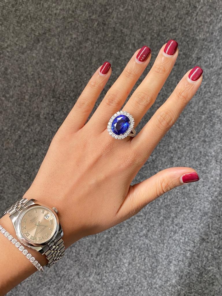 Make a statement when you wear this gorgeous 14.46 carat Tanzanite and Diamond cocktail ring. The 2.22 carat White Diamonds used are all VS quality, colorless - all set in solid 8.75 grams of 18K White Gold. 
The ring is currently sized at US 7, can