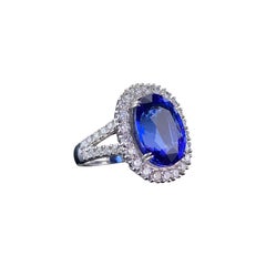 Certified 14.46 Carat Oval Tanzanite and Diamond 18k Gold Engagement Ring