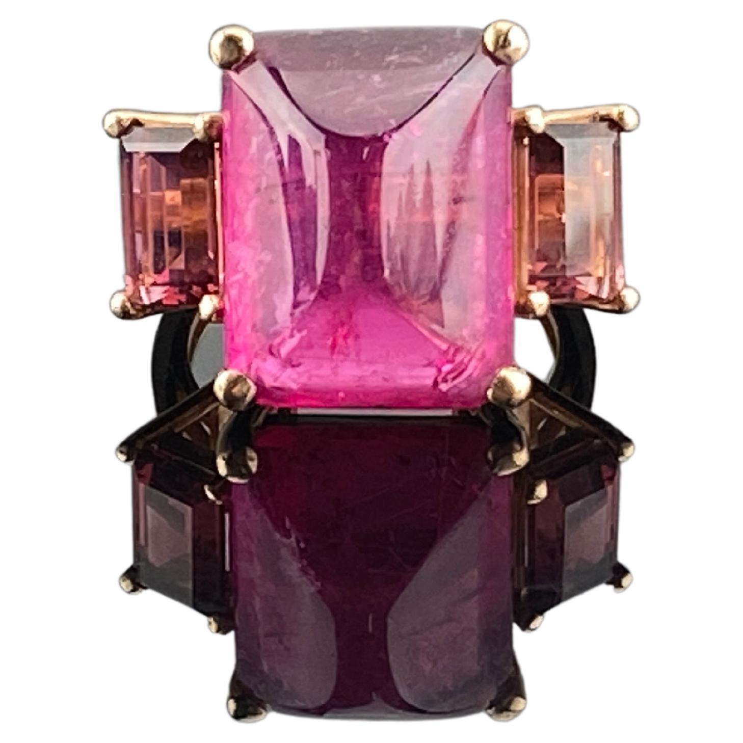 A beautiful, 14.53 carat Pink Tourmaline Ring with 2.85 carat Tourmaline side stones - all set in 18K Rose Gold. The simple, elegant design of the ring really enhances the beauty of the Gemstone, making it a one of a kind. The ring is currently