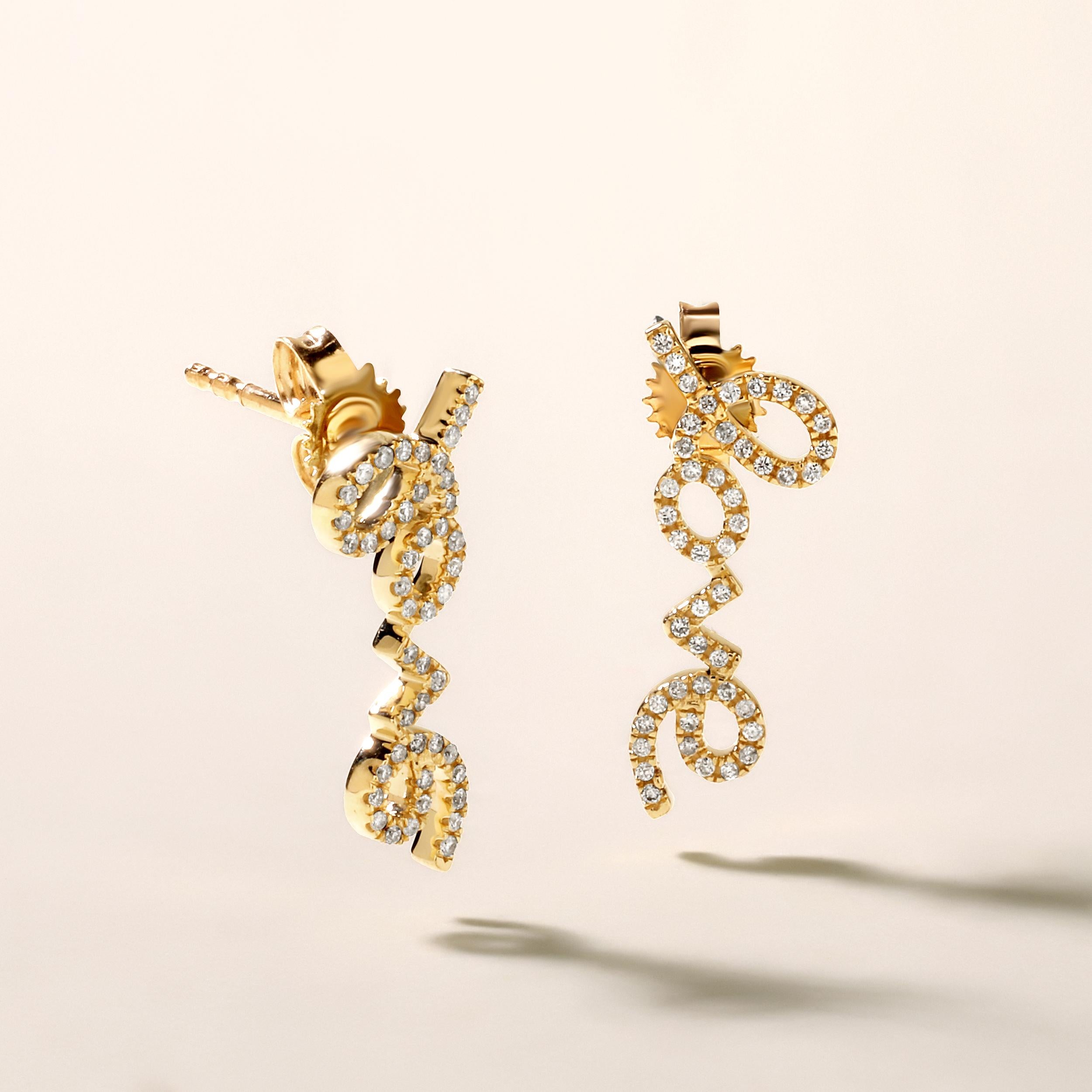 Crafted in 1.72 grams of 14K Yellow Gold, the earrings contains 92 stones of Round Diamonds with a total of 0.16 carat in F-G color and SI clarity.

CONTEMPORARY AND TIMELESS ESSENCE: Crafted in 14-karat/18-karat with 100% natural diamond and