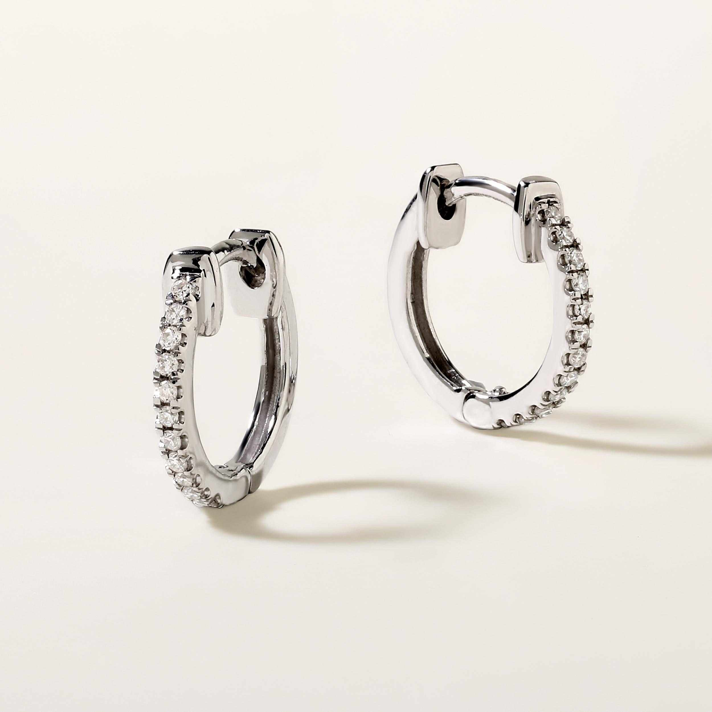 Crafted in 1.29 grams of 14K White Gold, the earrings contains 24 stones of Round Diamonds with a total of 0.09 carat in G-H color and SI clarity.

CONTEMPORARY AND TIMELESS ESSENCE: Crafted in 14-karat/18-karat with 100% natural diamond and
