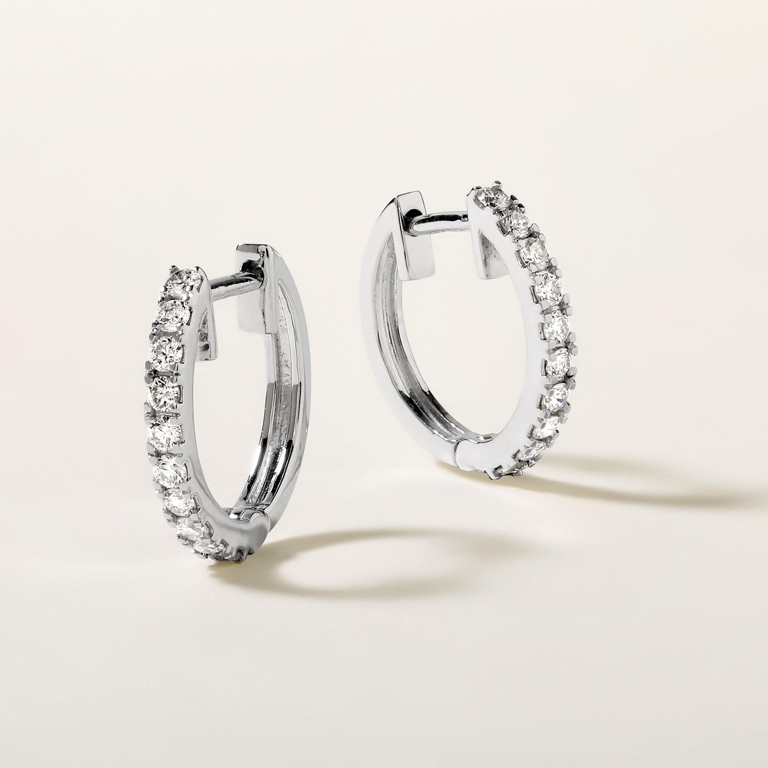 Crafted in 2.14 grams of 14K White Gold, the earrings contains 20 stones of Round Diamonds with a total of 0.35 carat in G-H color and SI clarity.

This jewelry piece will be expertly crafted by our skilled artisans upon order. Allow us a shipping
