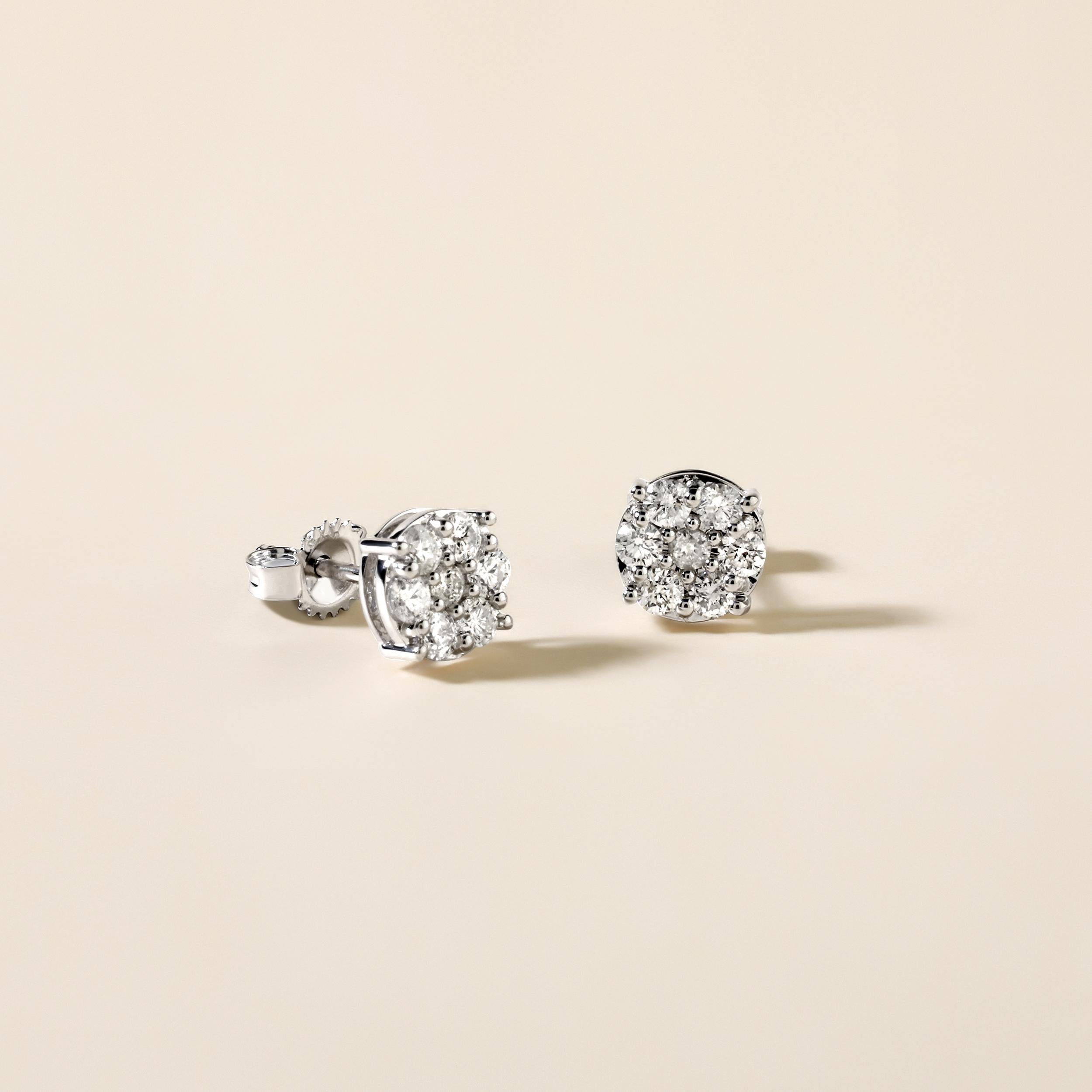 Crafted in 1.26 grams of 14K White Gold, the earrings contains 14 stones of Round Diamonds with a total of 0.52 carat in F-G color and I1-I2 clarity.

CONTEMPORARY AND TIMELESS ESSENCE: Crafted in 14-karat/18-karat with 100% natural diamond and