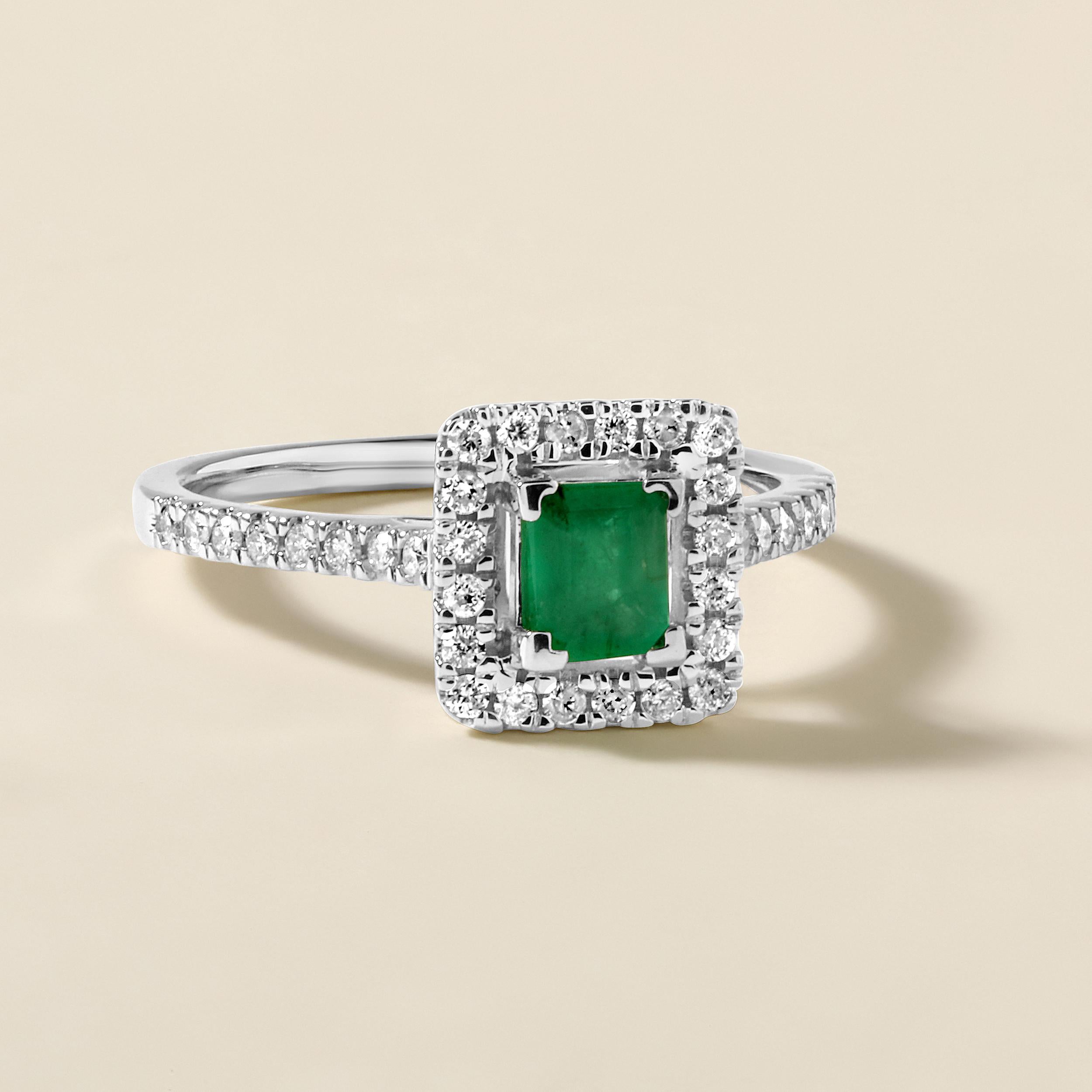 Ring Size: US 7

Crafted in 2.77 grams of 14K White Gold, the ring contains 36 stones of Round Natural Diamonds with a total of 0.29 carat in G-H color and I1-I2 clarity combined with 1 stone of Natural Emerald Gemstone with a total of 0.47