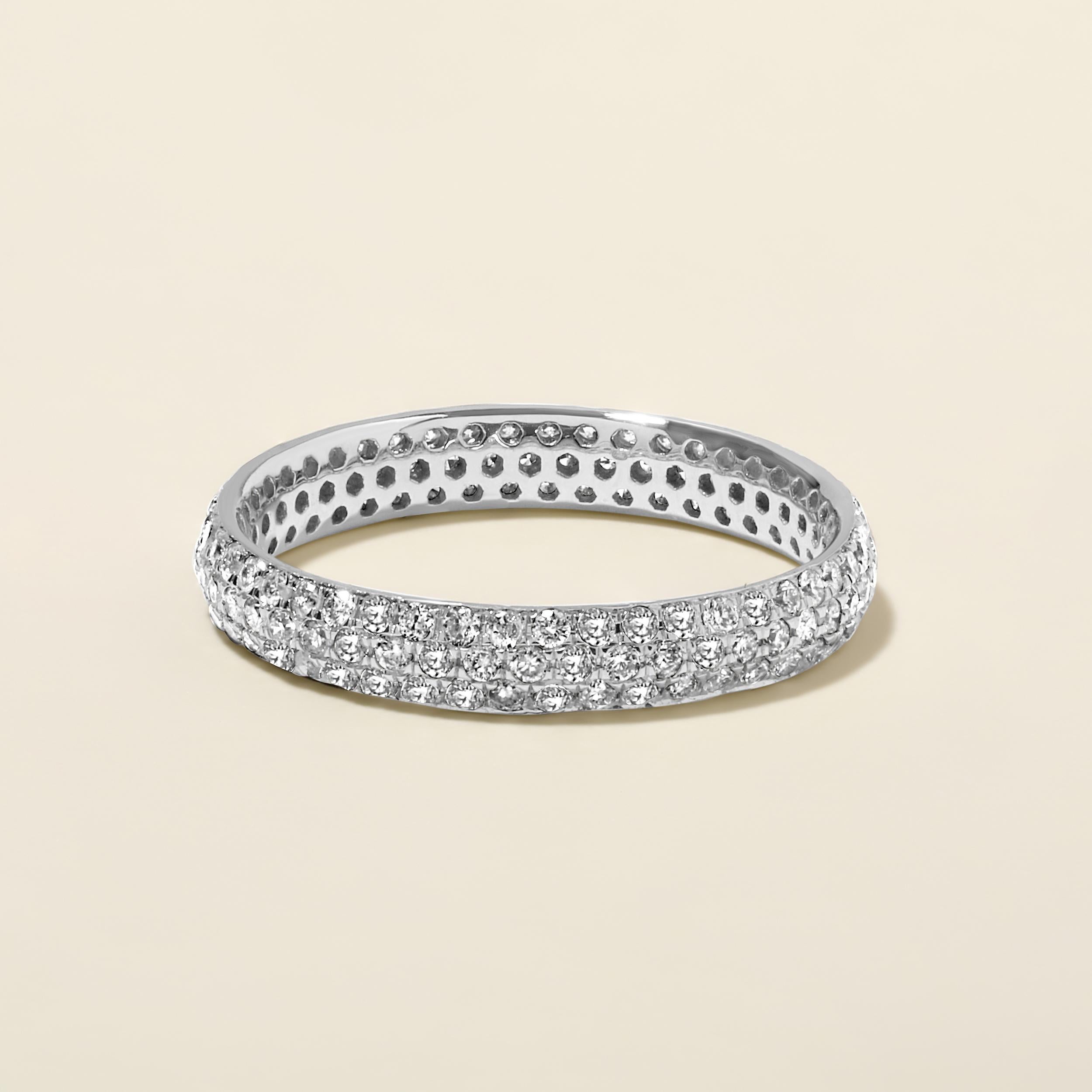 Ring Size: US 7

Crafted in 1.5 grams of 14K White Gold, the ring contains 141 stones of Round Natural Diamonds with a total of 0.87 carat in F-G color and I1-I2 clarity.

CONTEMPORARY AND TIMELESS ESSENCE: Crafted in 14-karat/18-karat with 100%